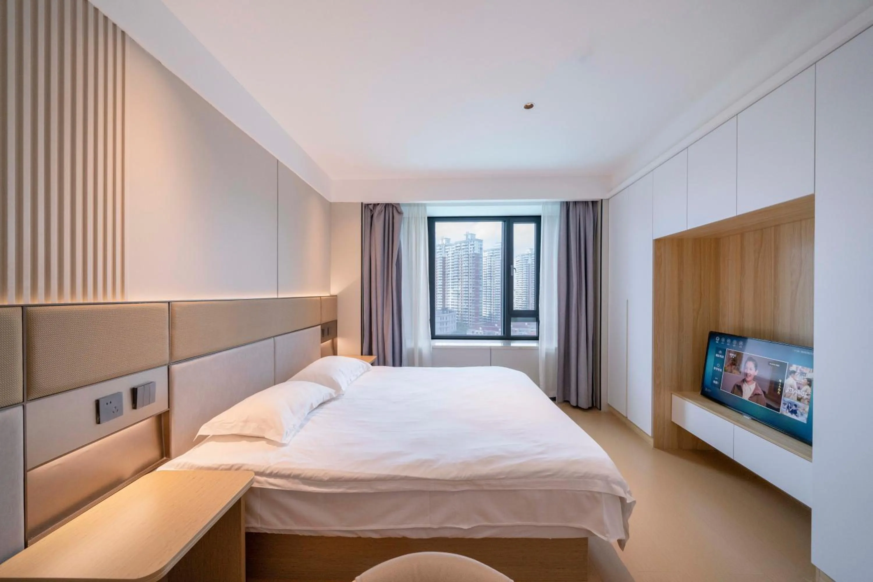 Bed in Shanghai Jiarong Hotel Apartment