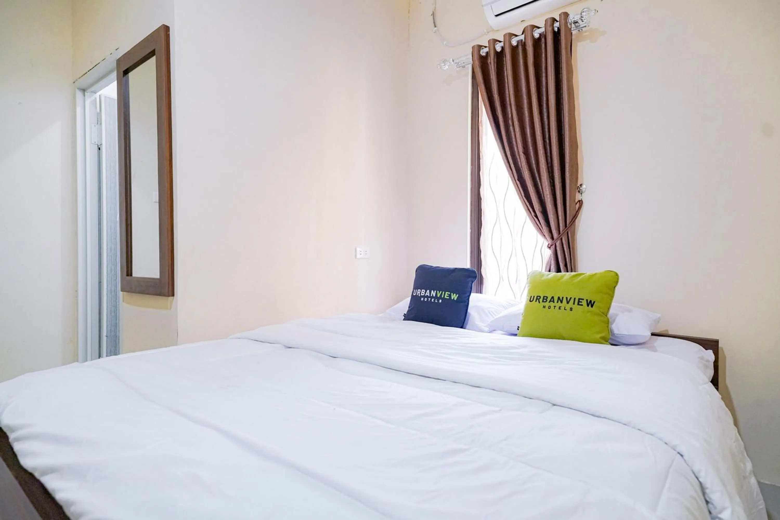 Bed in Urbanview Hotel St Faustina Lampung by RedDoorz