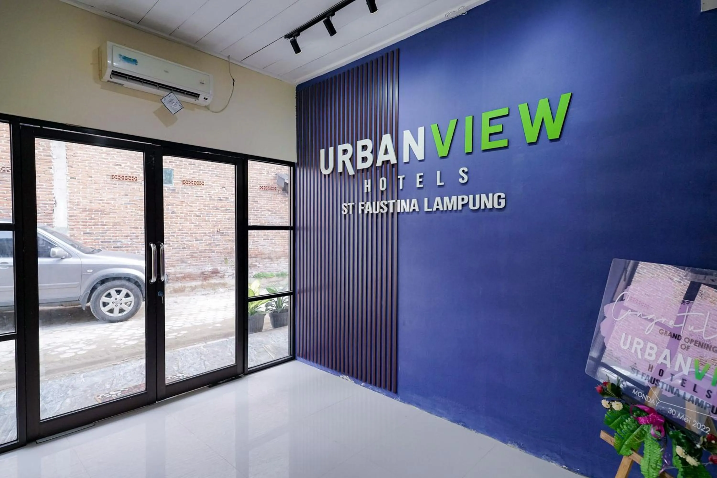 Property logo or sign in Urbanview Hotel St Faustina Lampung by RedDoorz