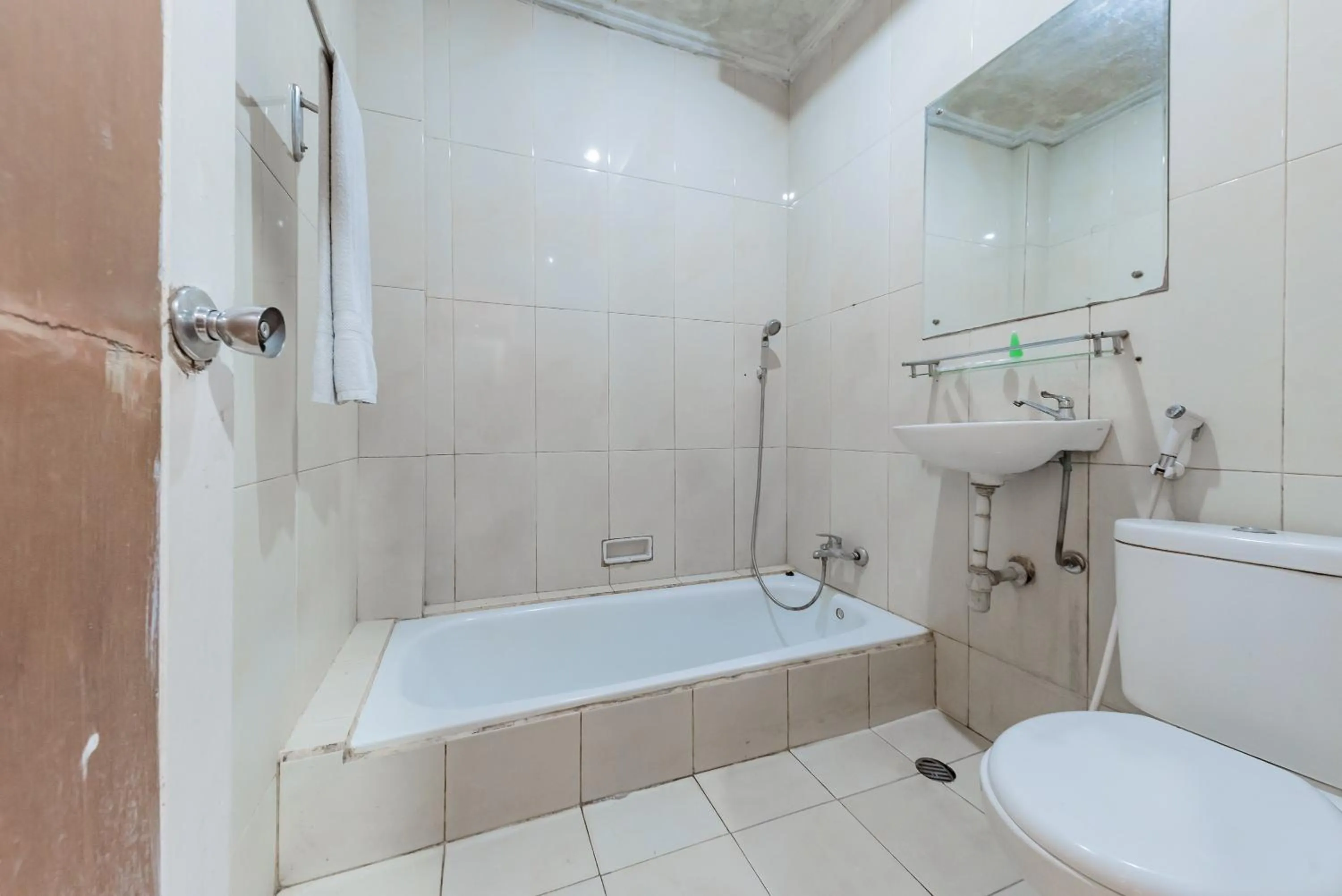 Bathroom in Urbanview Hotel Crown Tasikmalaya by RedDoorz