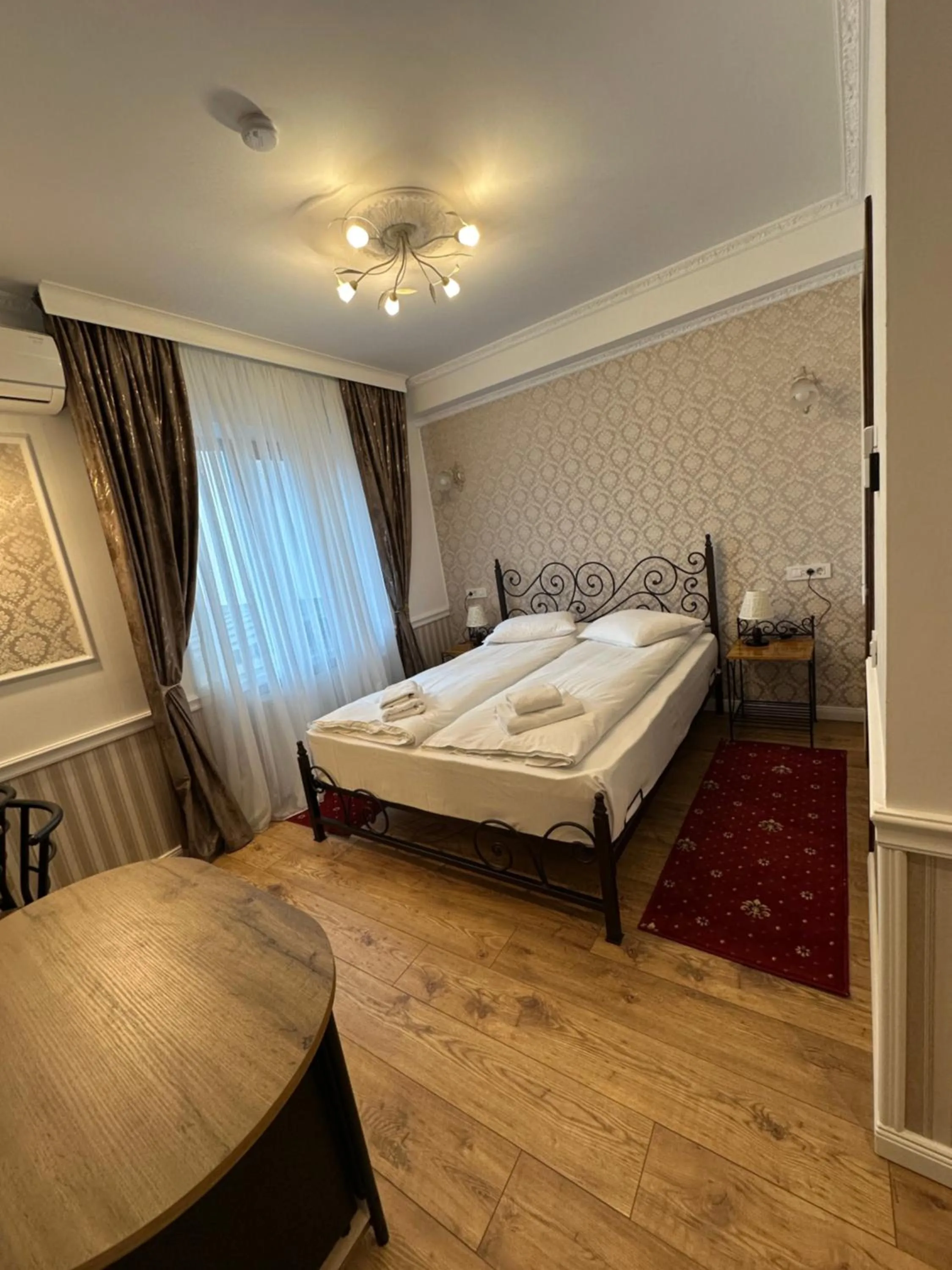 Bed in Hotel Boutique Cathedral Plaza Residences room for rent downtown