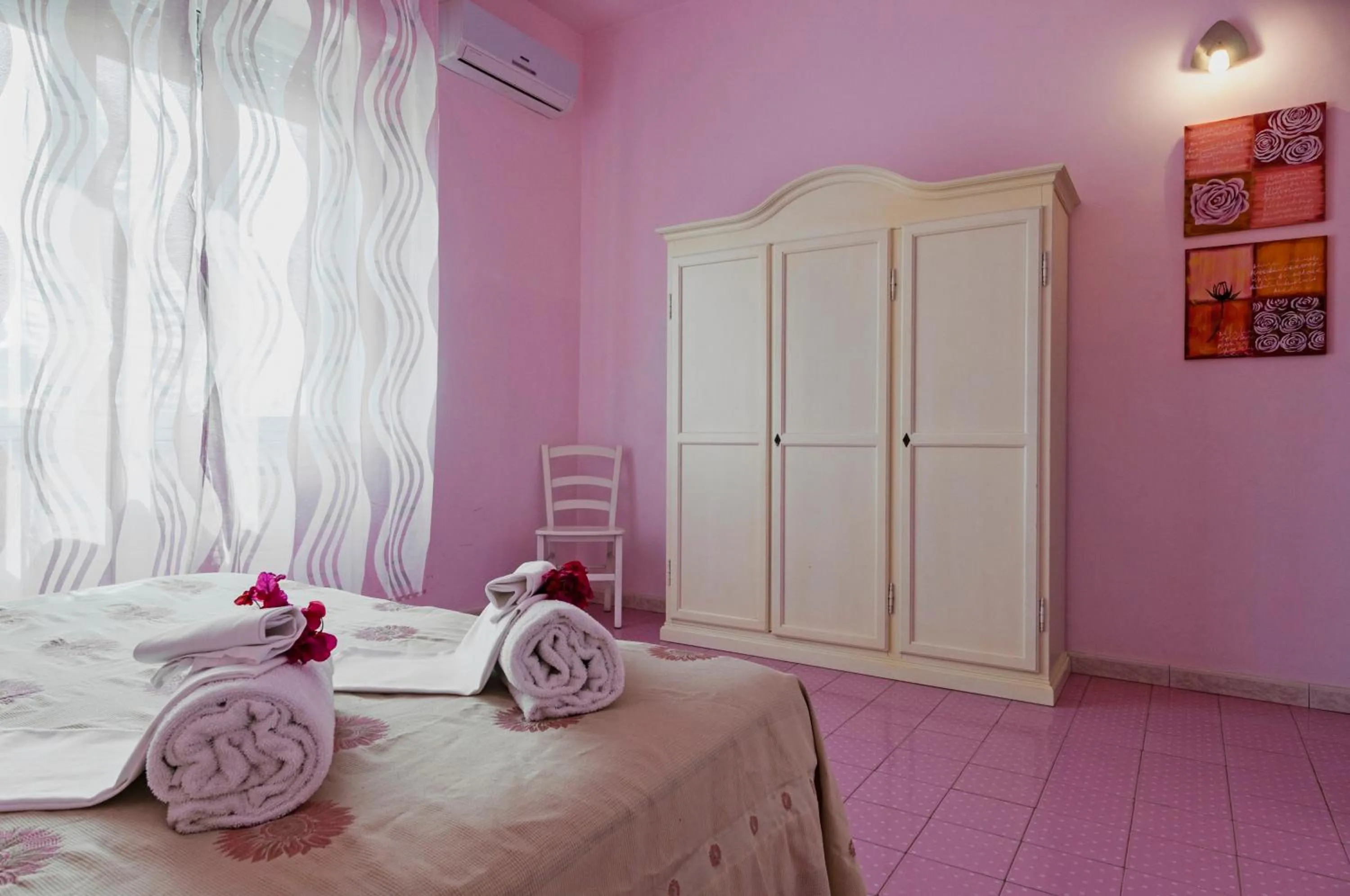 Bed in Stella del mare Apartments