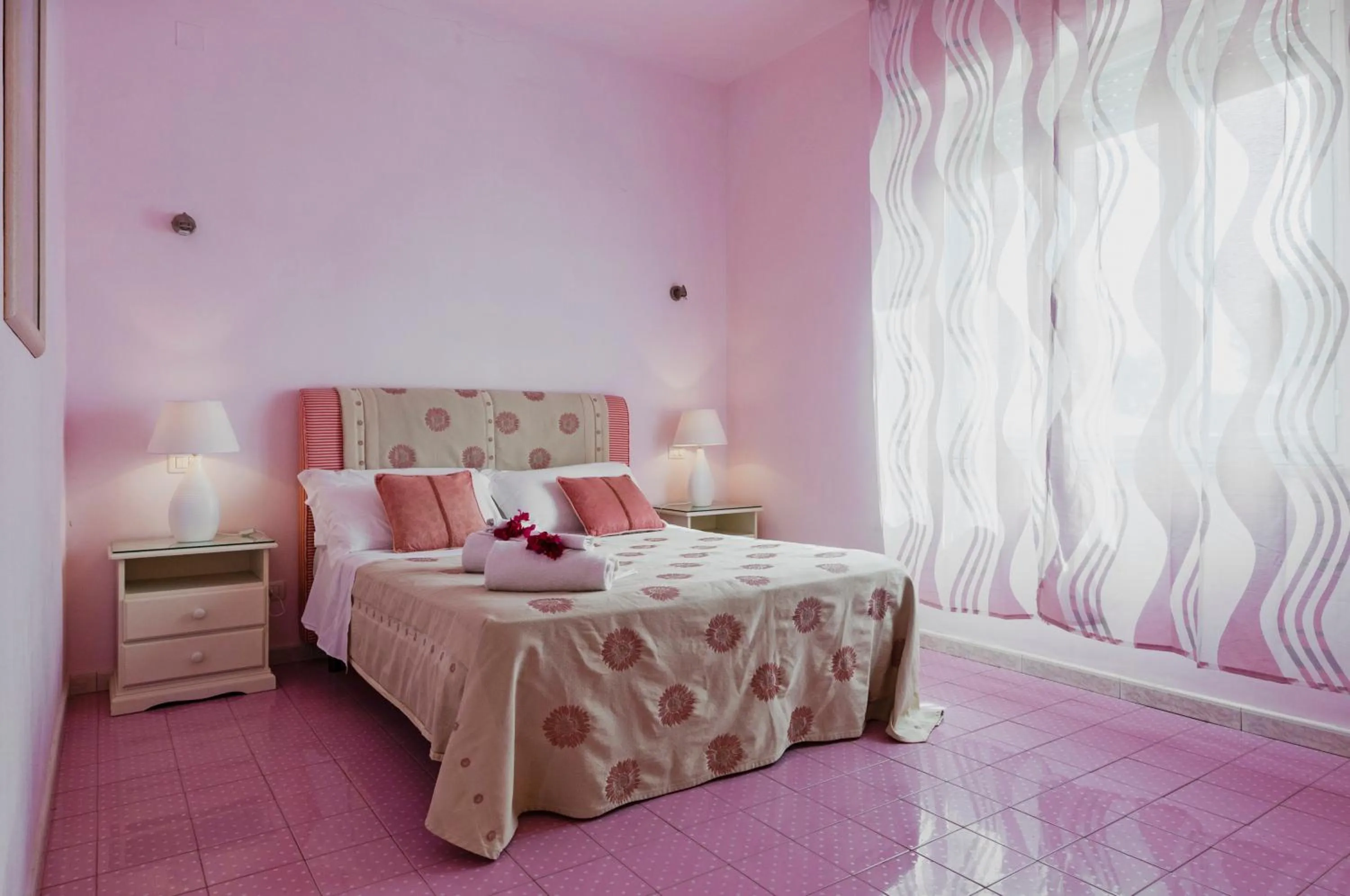 Bed in Stella del mare Apartments