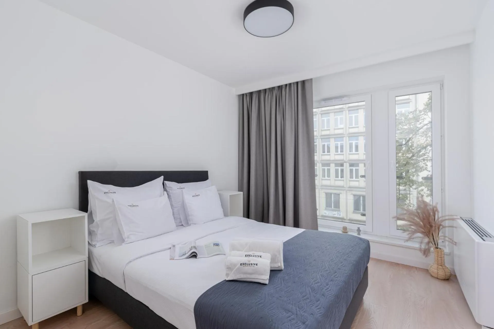 Bedroom in EXCLUSIVE Aparthotel Kraków Lubicz 40