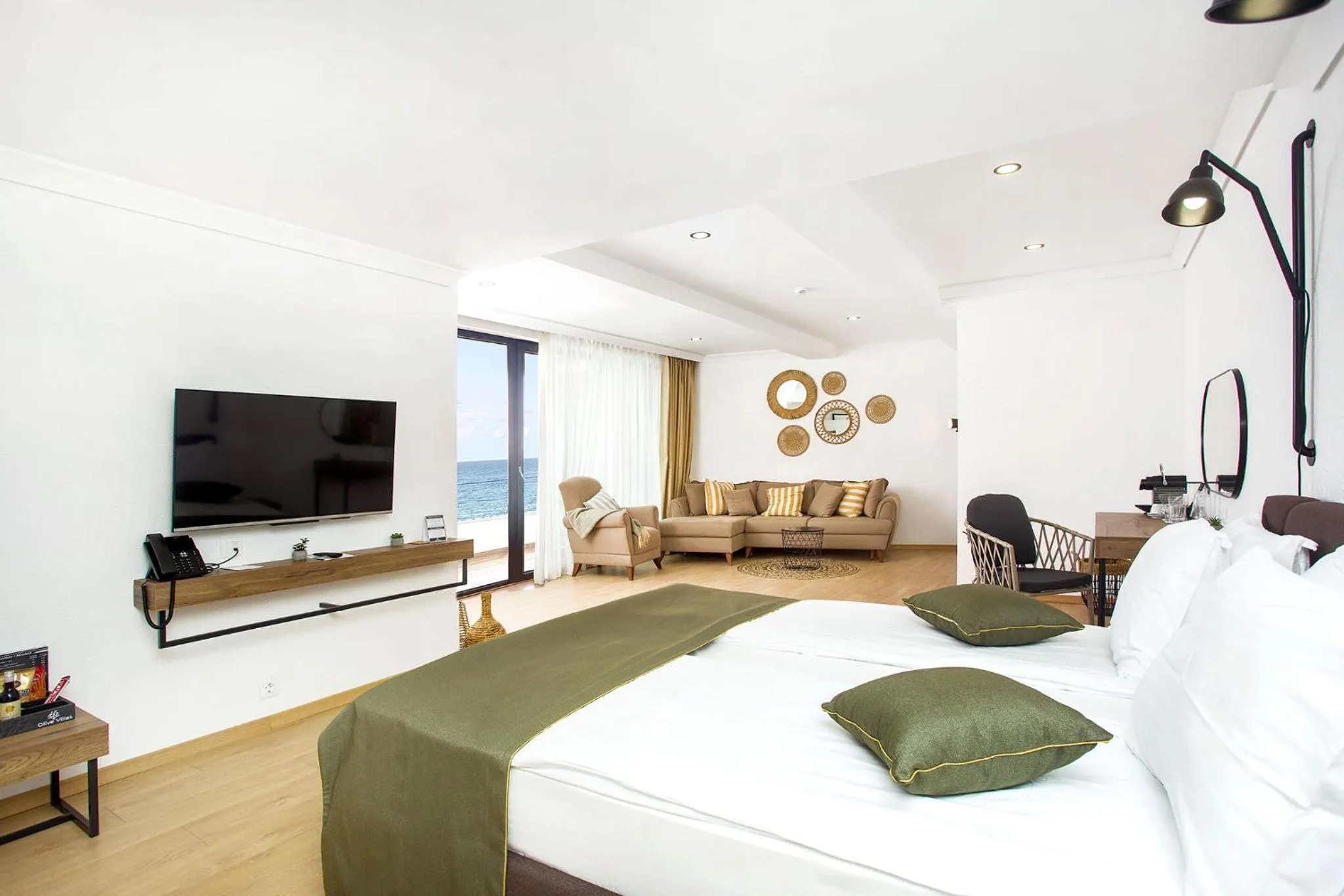 Communal lounge/ TV room, Bed in Olive Villas Beach Hotel