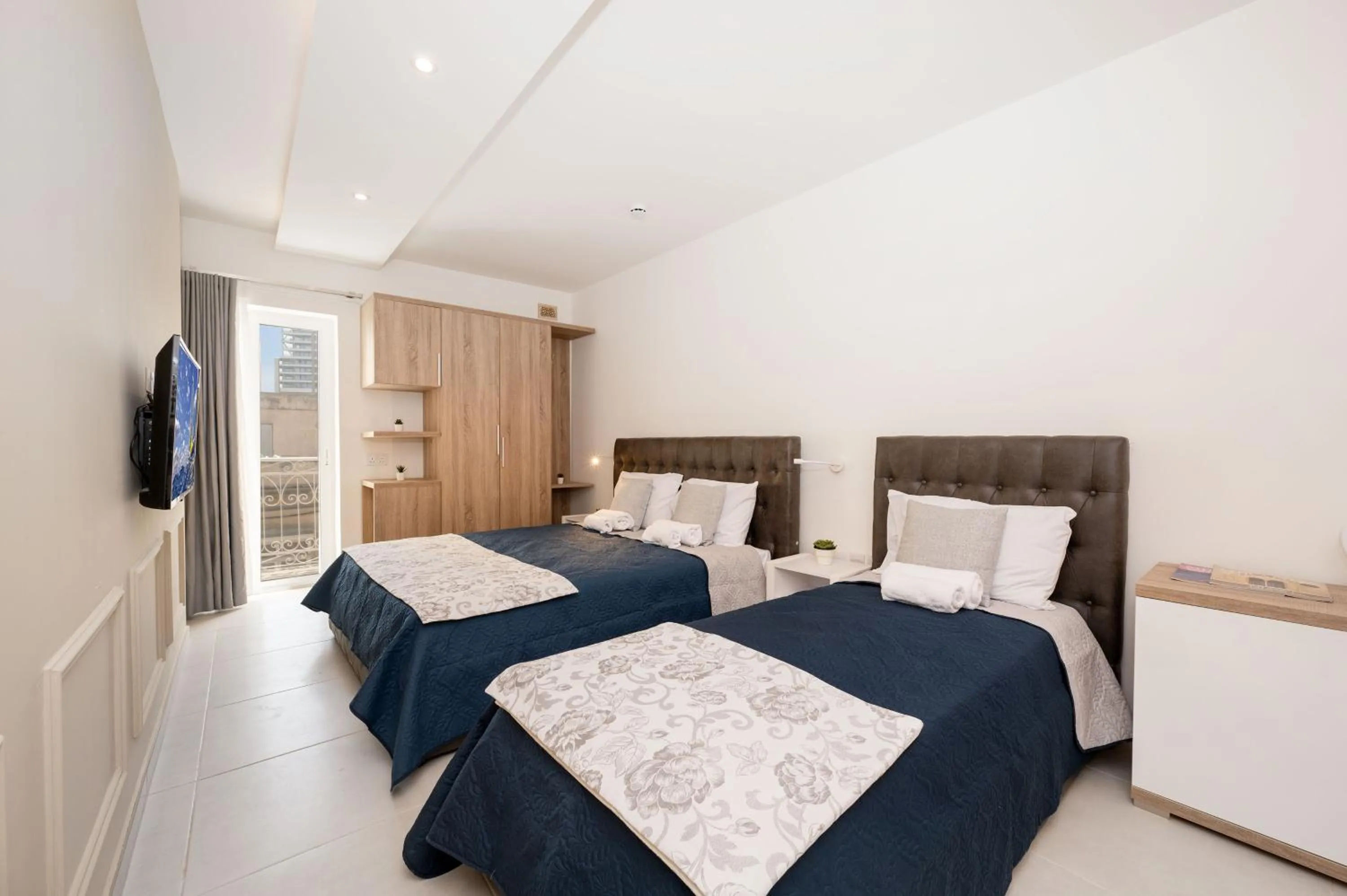 Bed in Vela Blu Boutique Suites