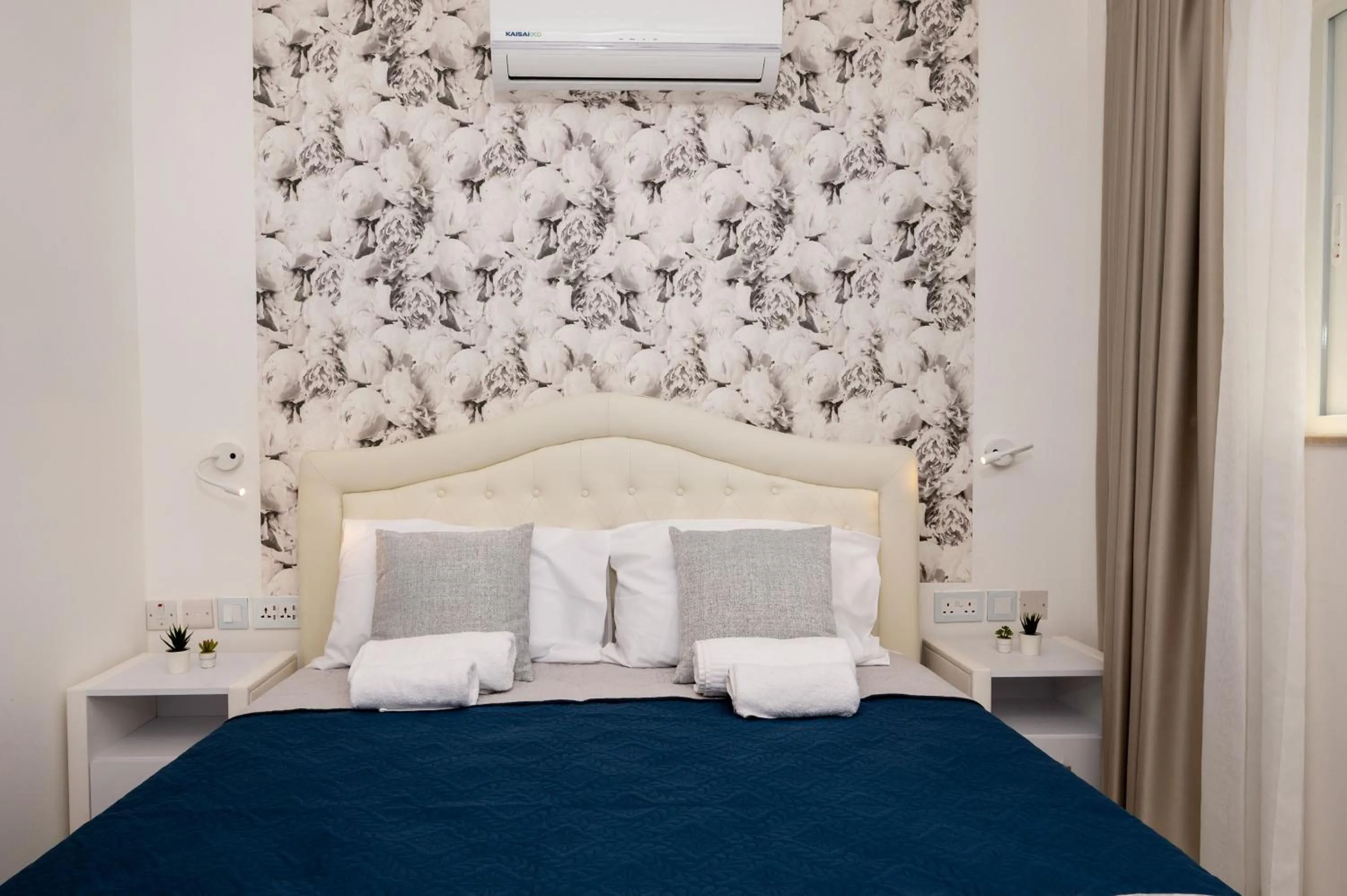 Bed in Vela Blu Boutique Suites