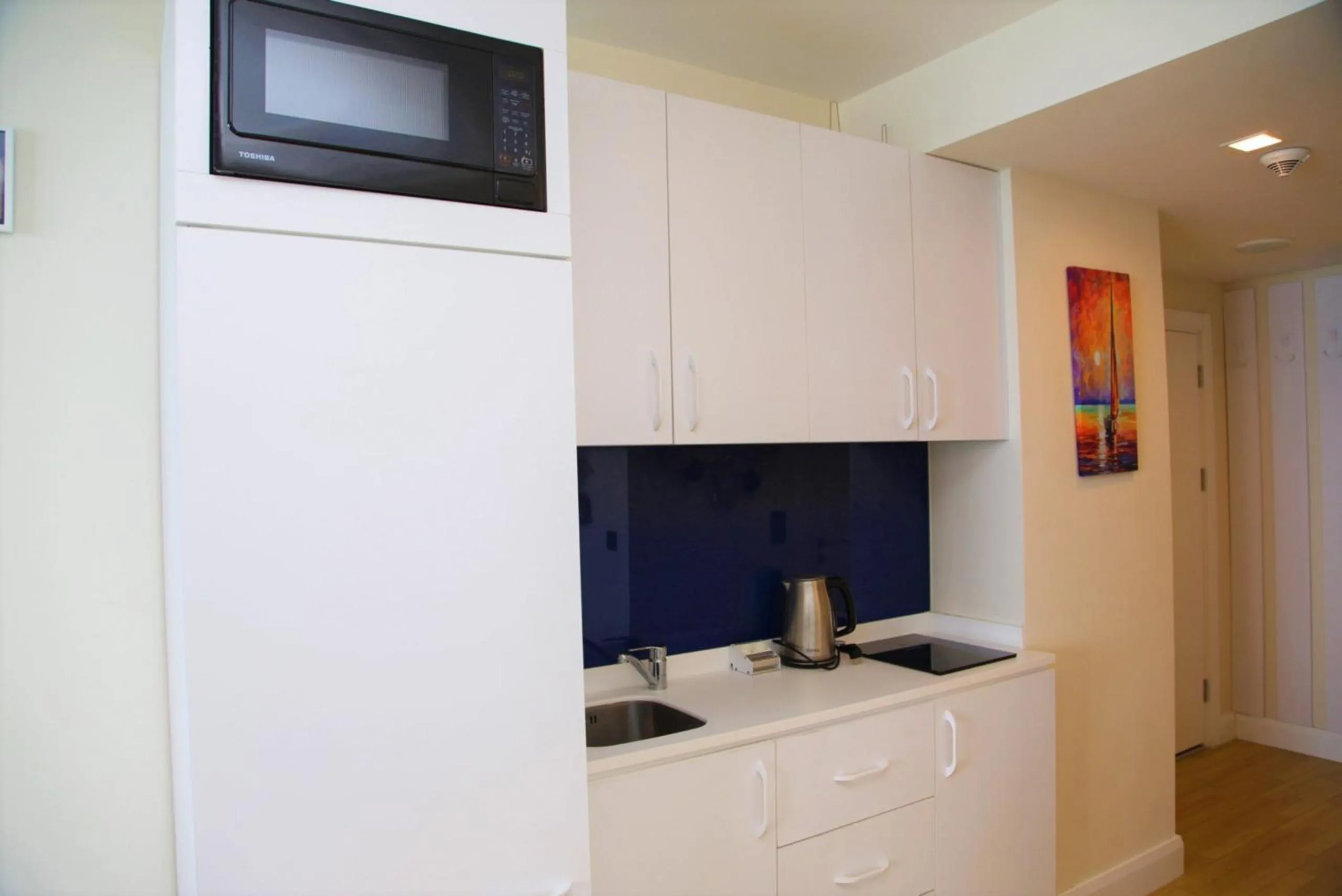 Kitchen or kitchenette in Orbi City Hotel With Sea View