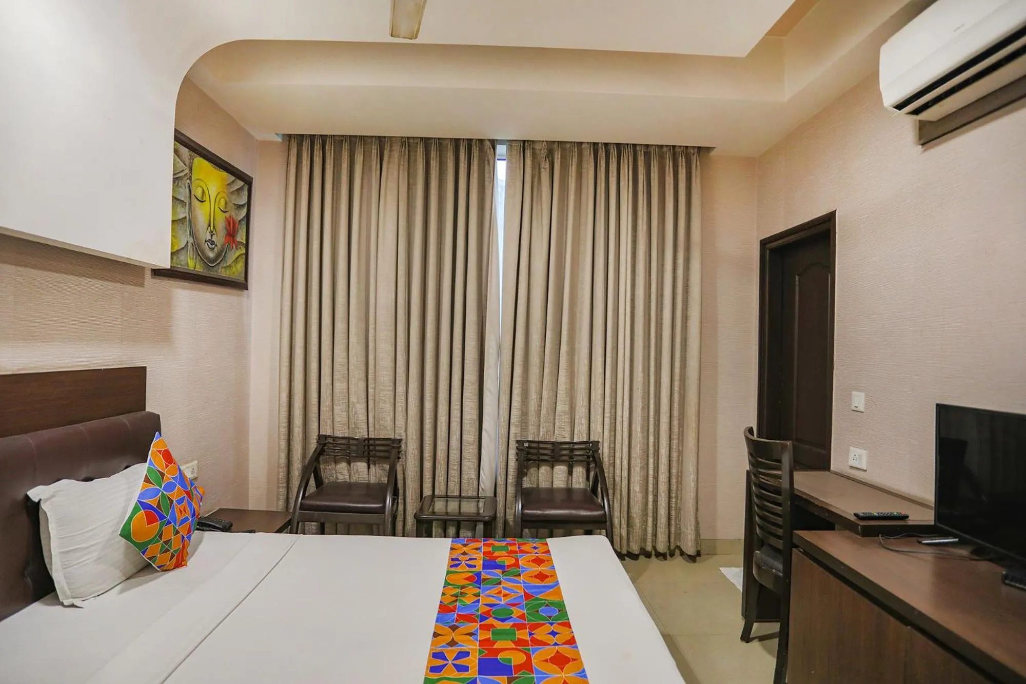 Bed in FabHotel Grand Olive