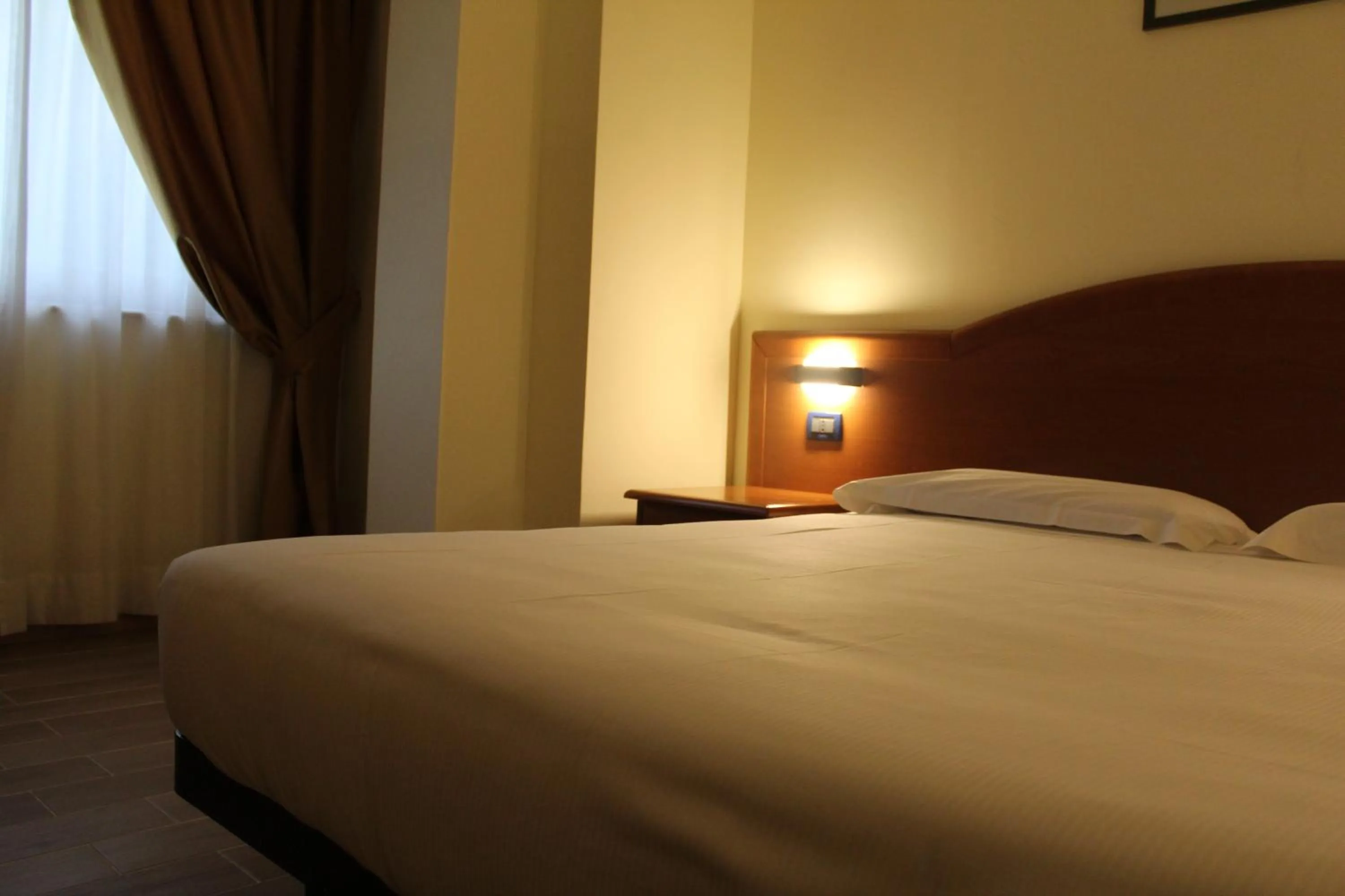 Bed in Hotel Dimora Adriana