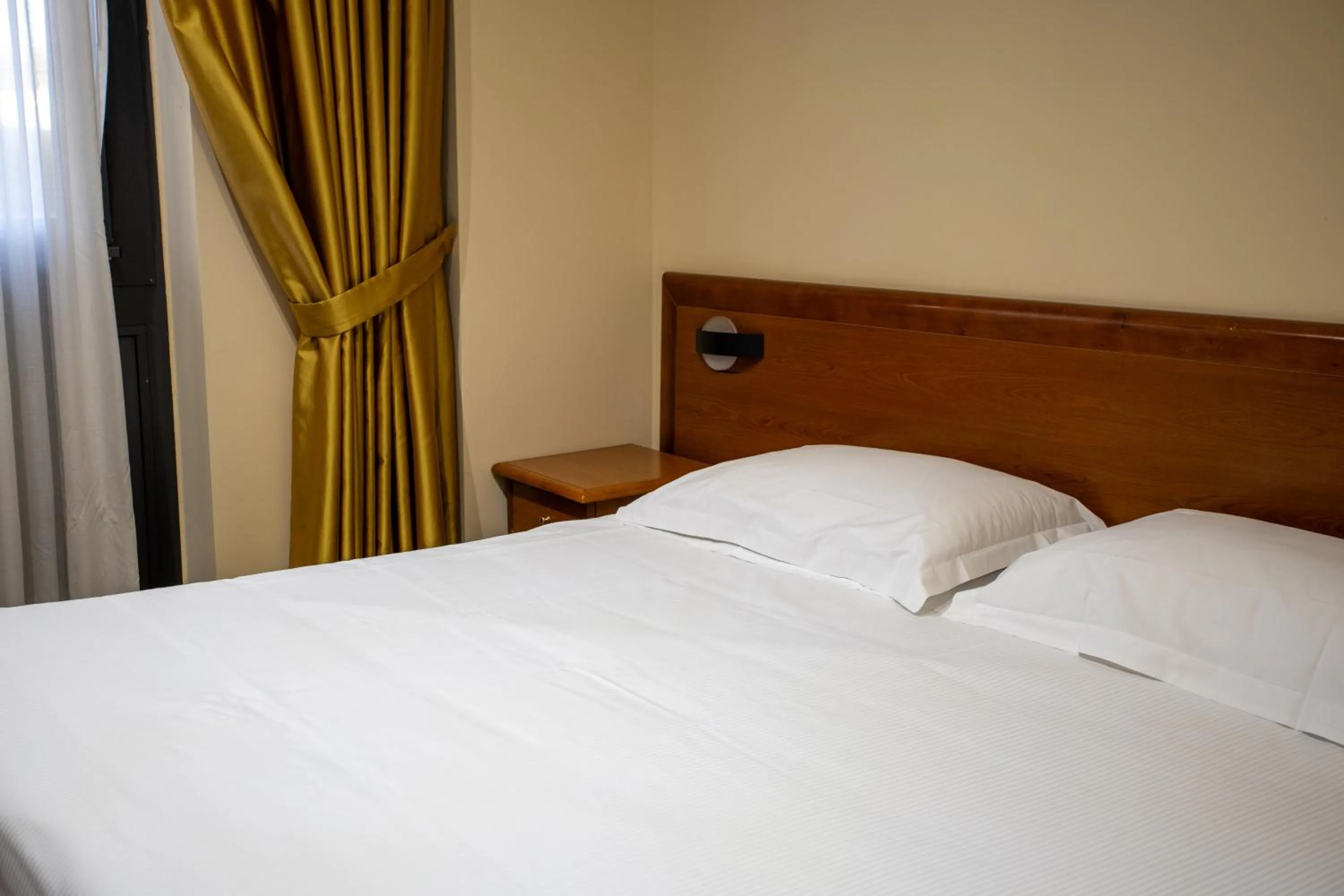 Bed in Hotel Dimora Adriana