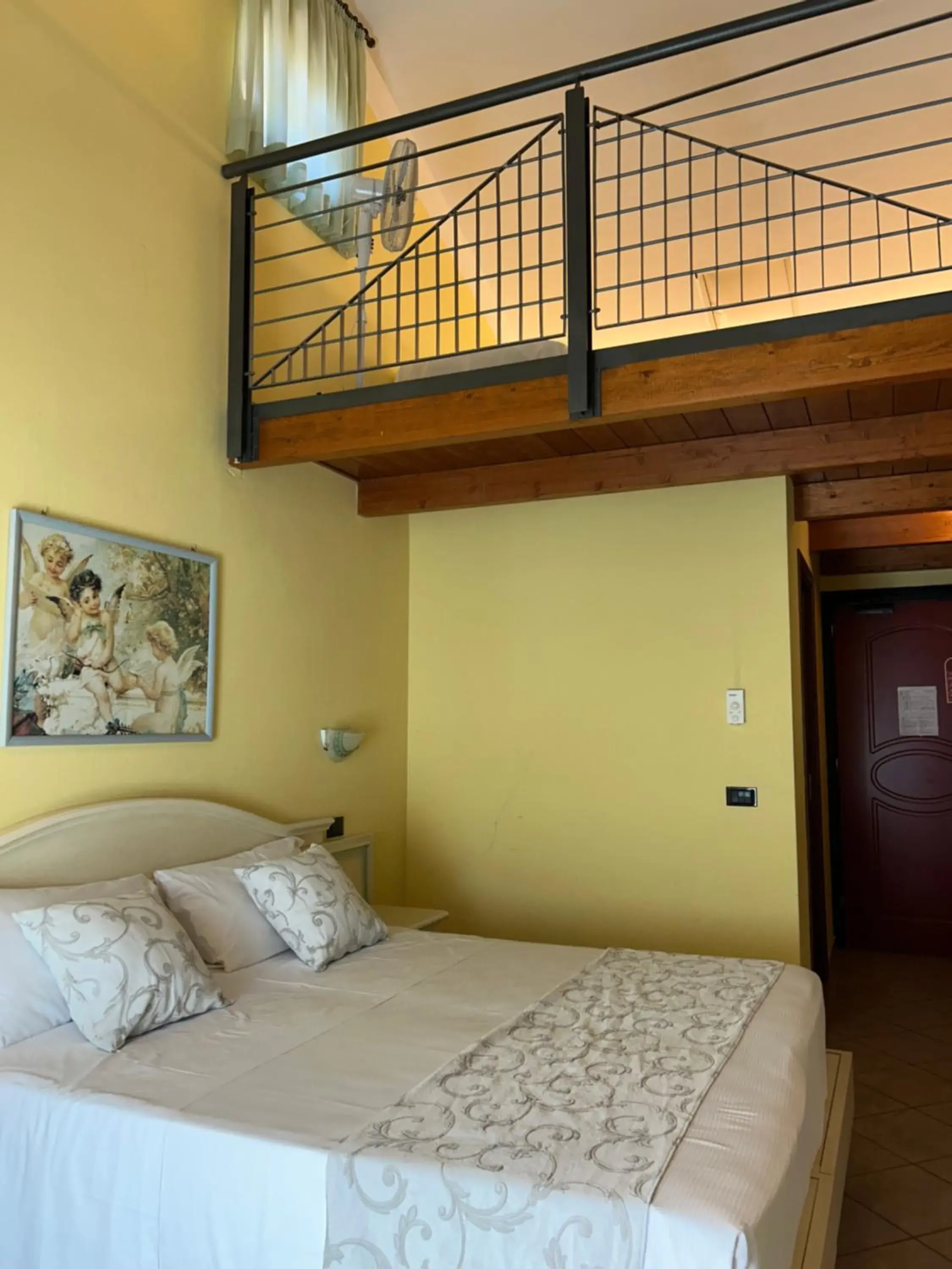 Duplex Quadruple Room in Hotel Duca Della Corgna Duplex Quadruple Room in Hotel Duca Della Corgna