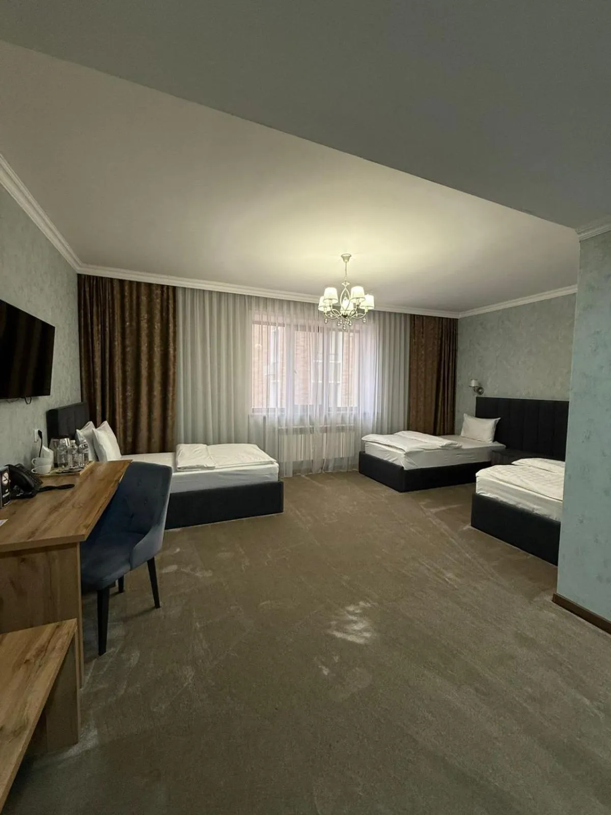 Bed in MirOtel Hotel