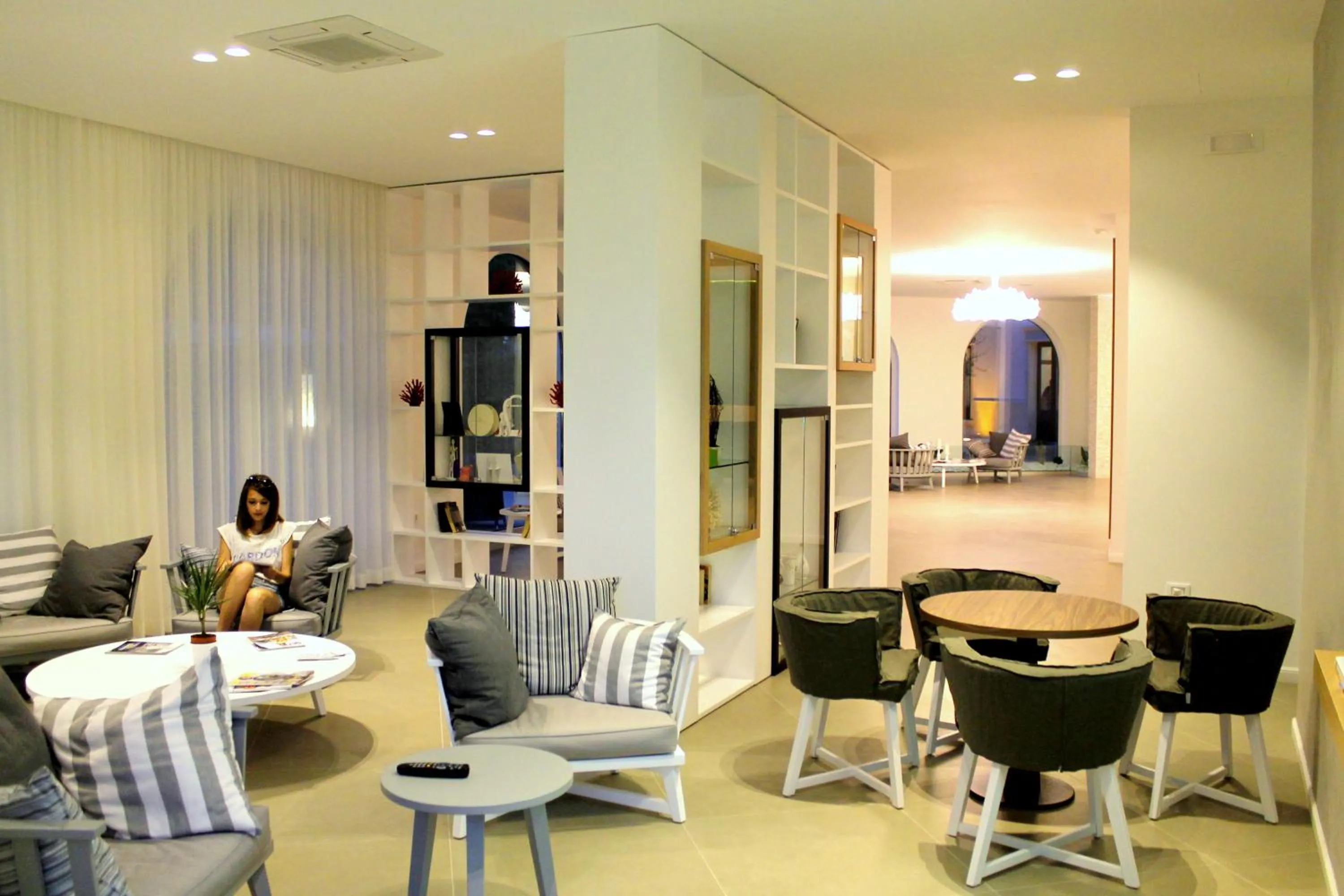 Communal lounge/ TV room in Giardino Dei Pini - Boutique Hotel