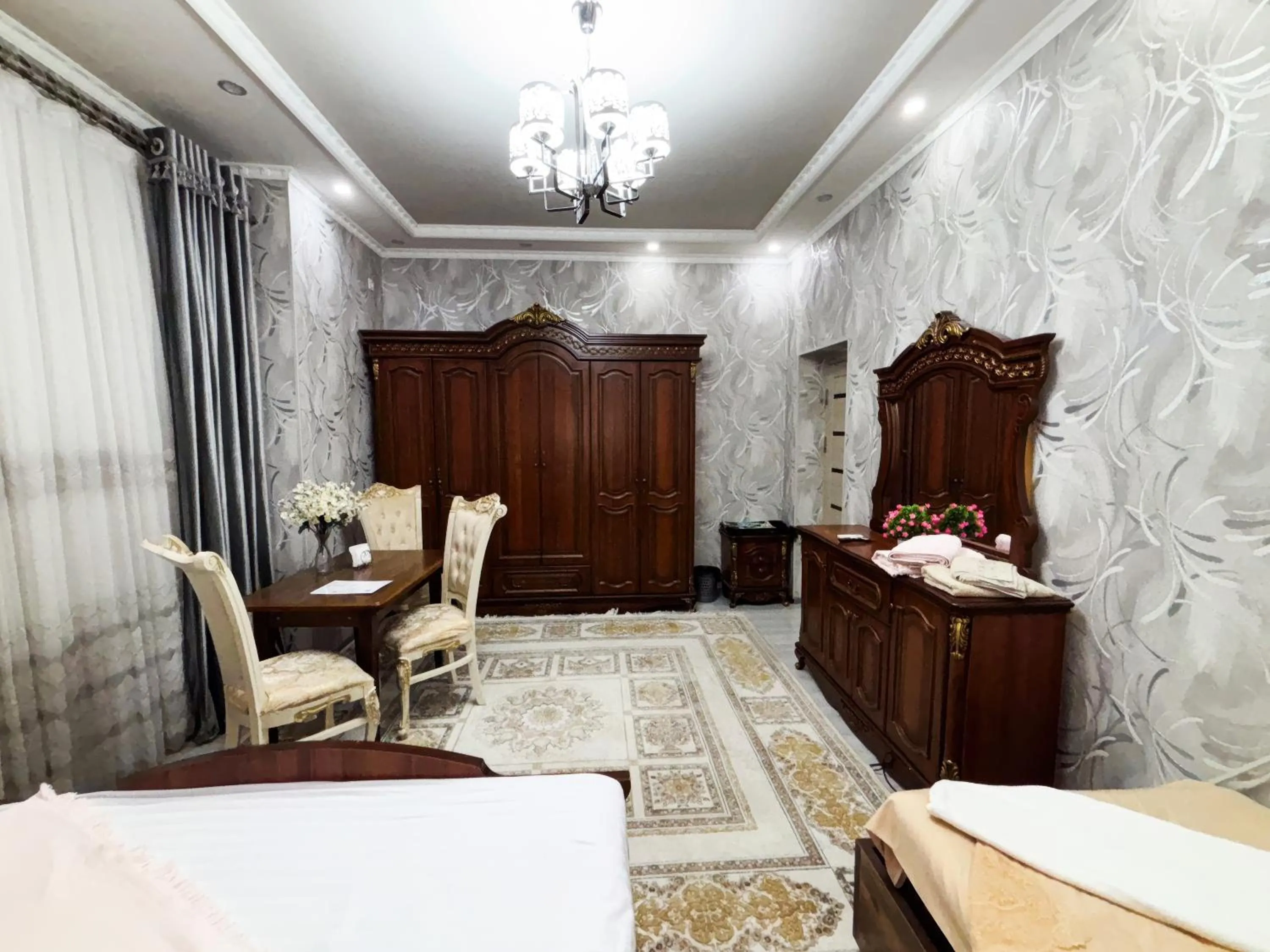 Seating area, Bed in Fayzli GuestHouse