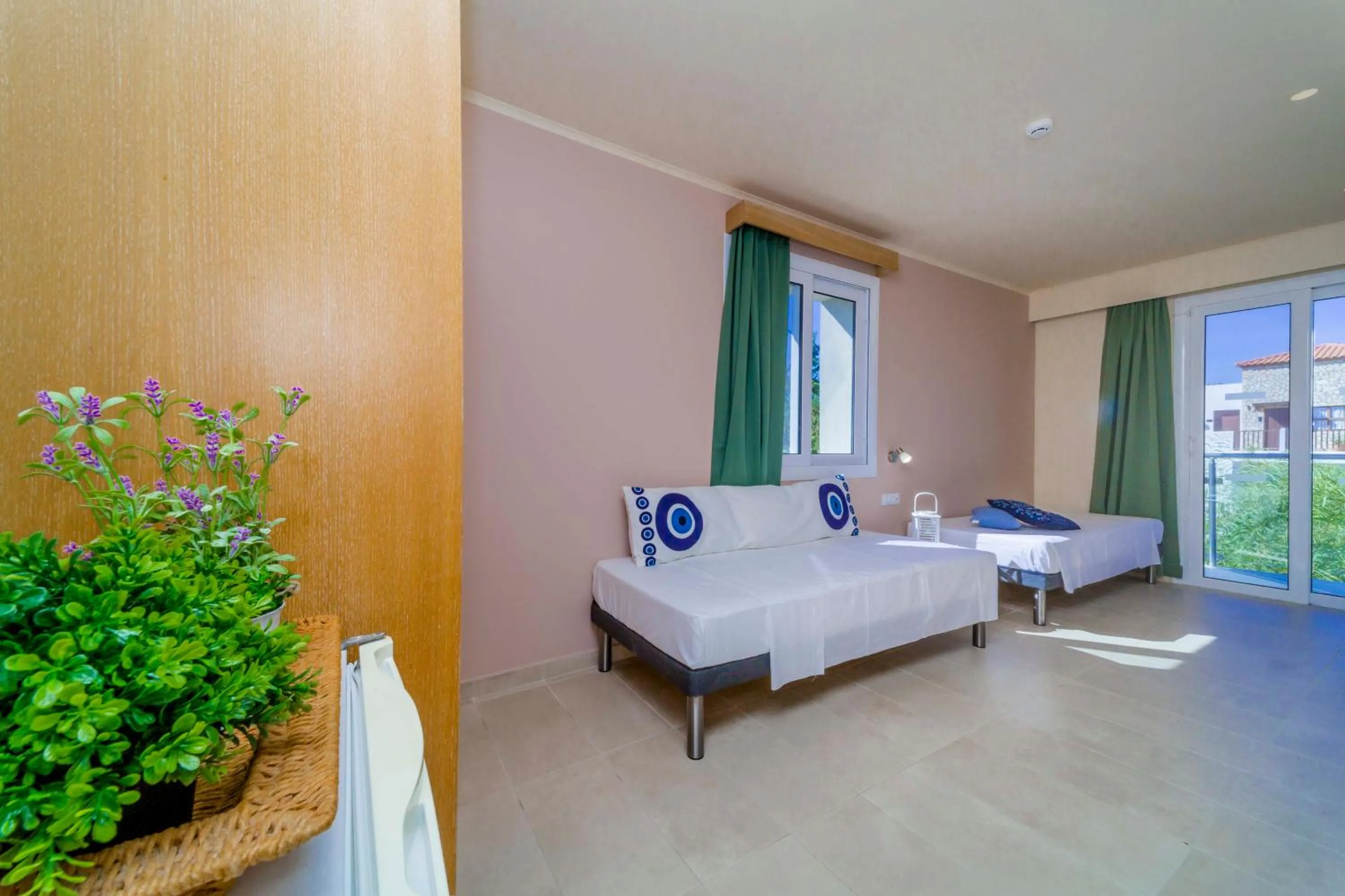 Photo of the whole room, Bed in Amaryllis front beach hotel