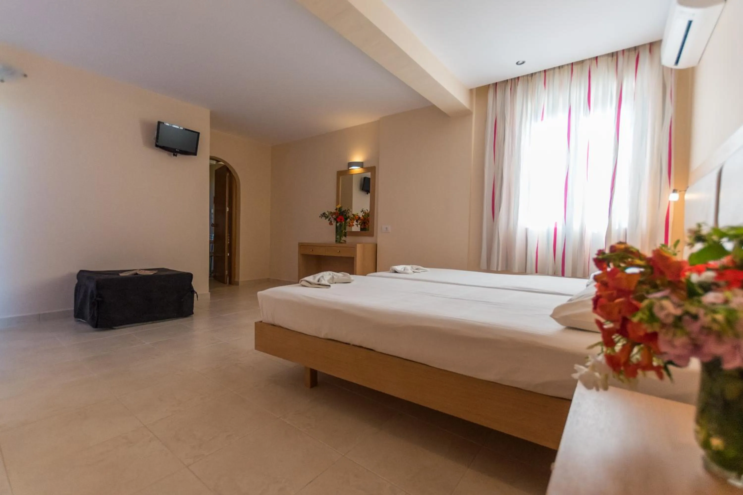 Photo of the whole room, Bed in Amaryllis front beach hotel