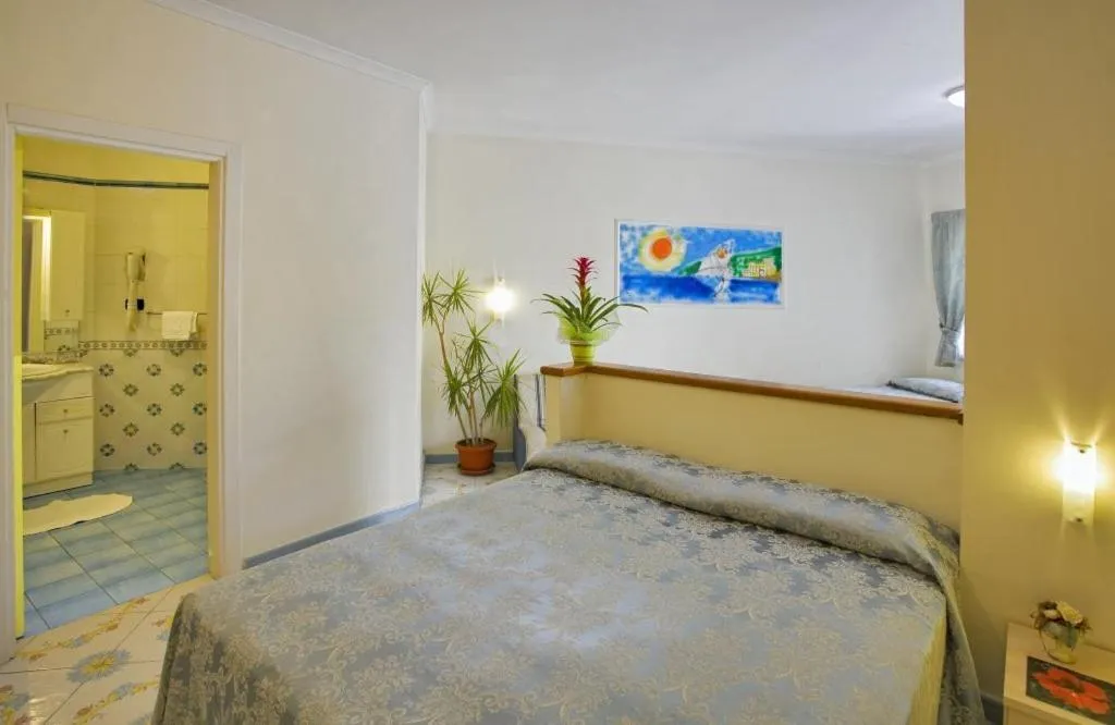 Bed in Albergo Villa Hibiscus