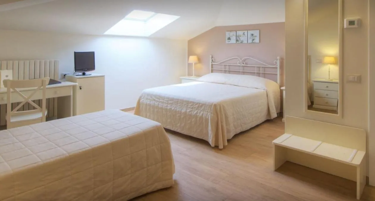 Bed in Hotel Giardino Suites&Spa