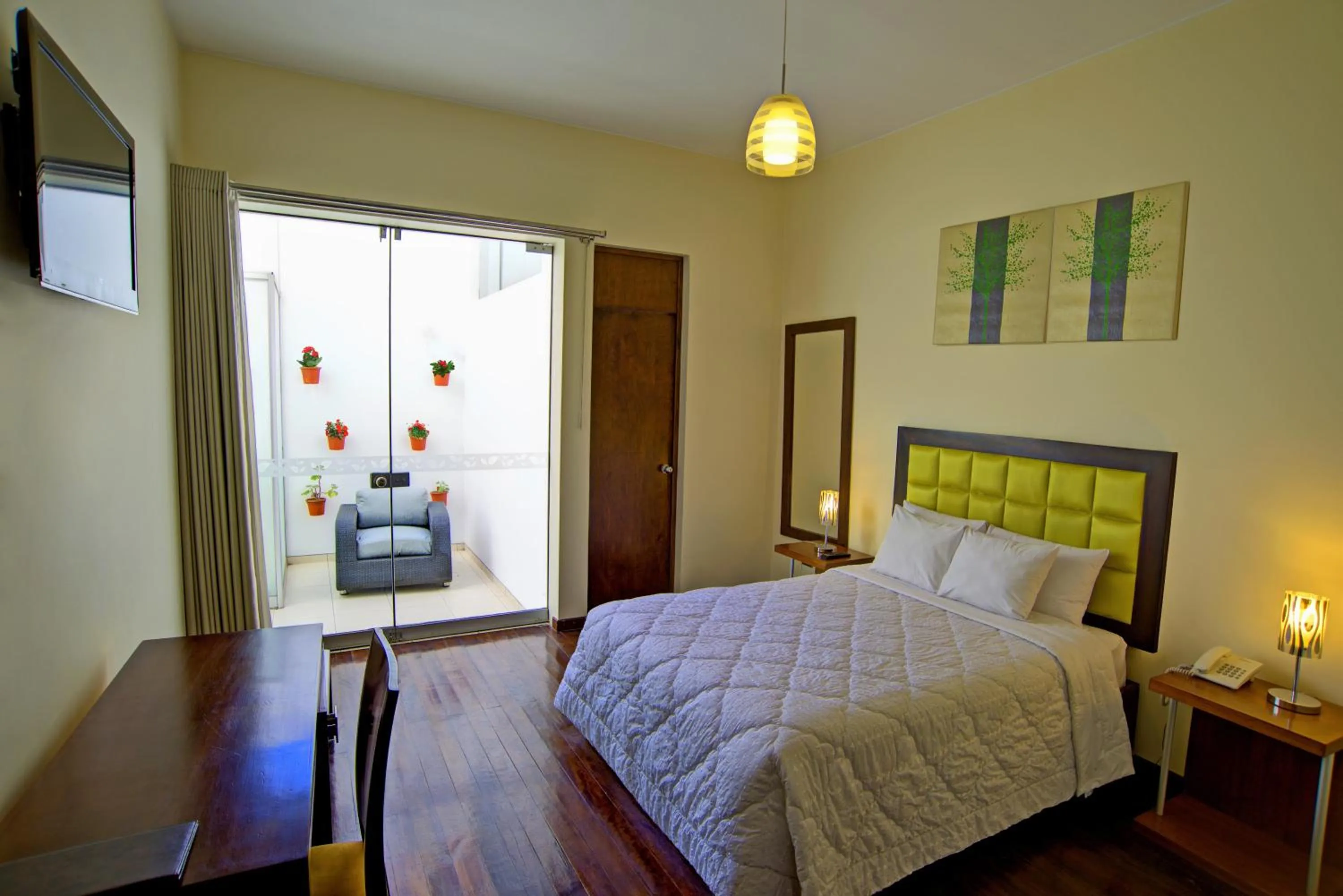 Patio, Bed in Mint Hotel