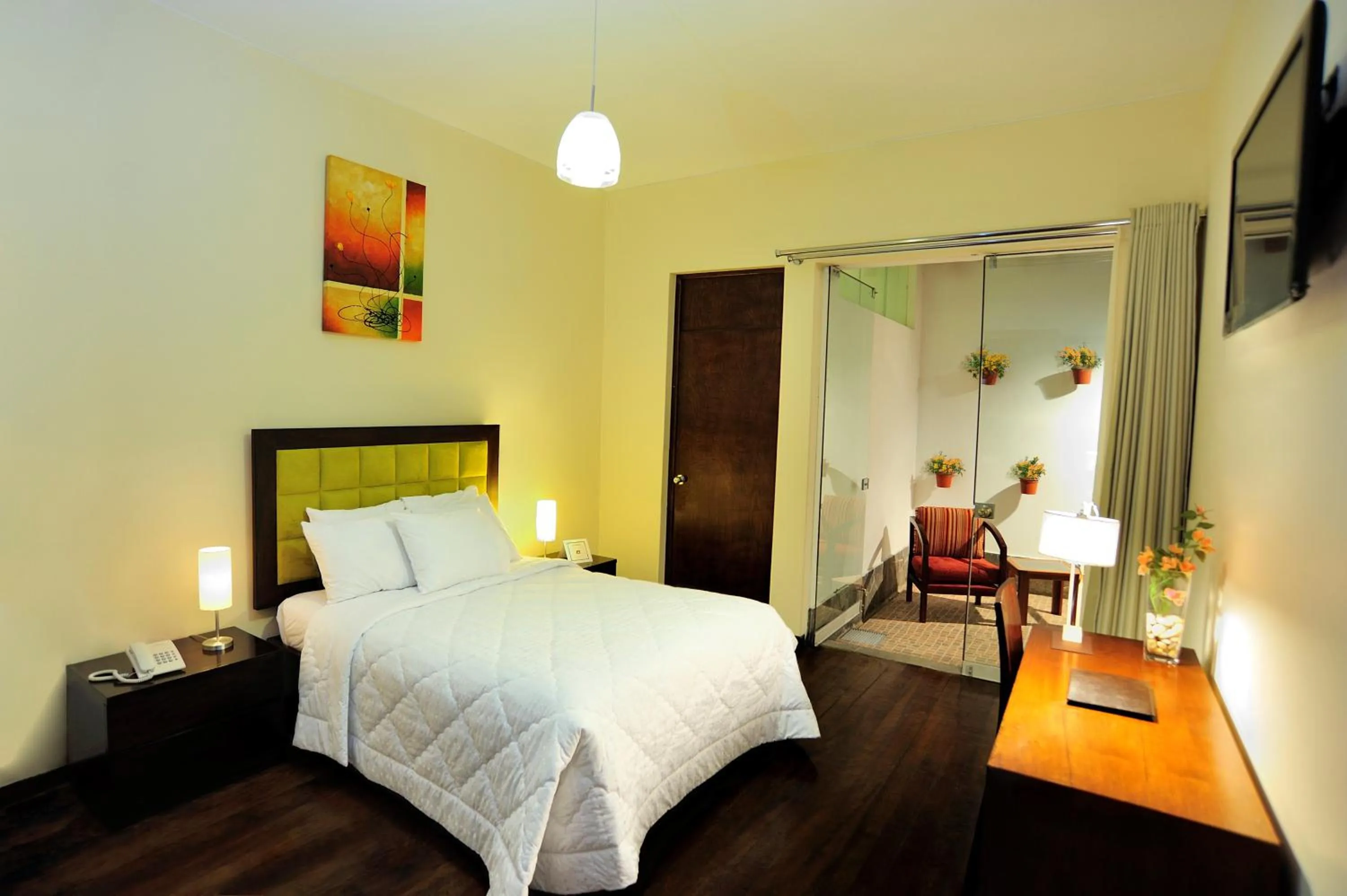 Patio, Bed in Mint Hotel