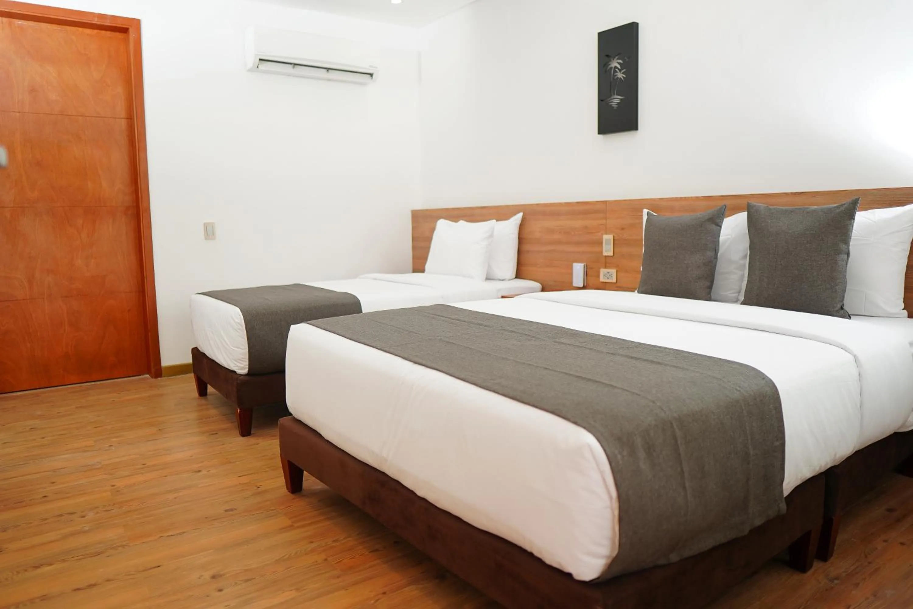 Bed in HOTEL KARAYA DIVE RESORT