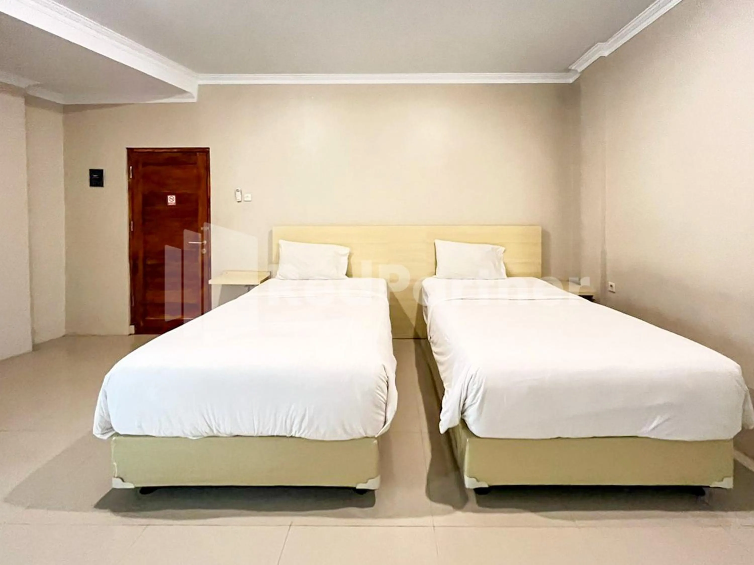 Bed in Hotel Andono near YIA Mitra RedDoorz