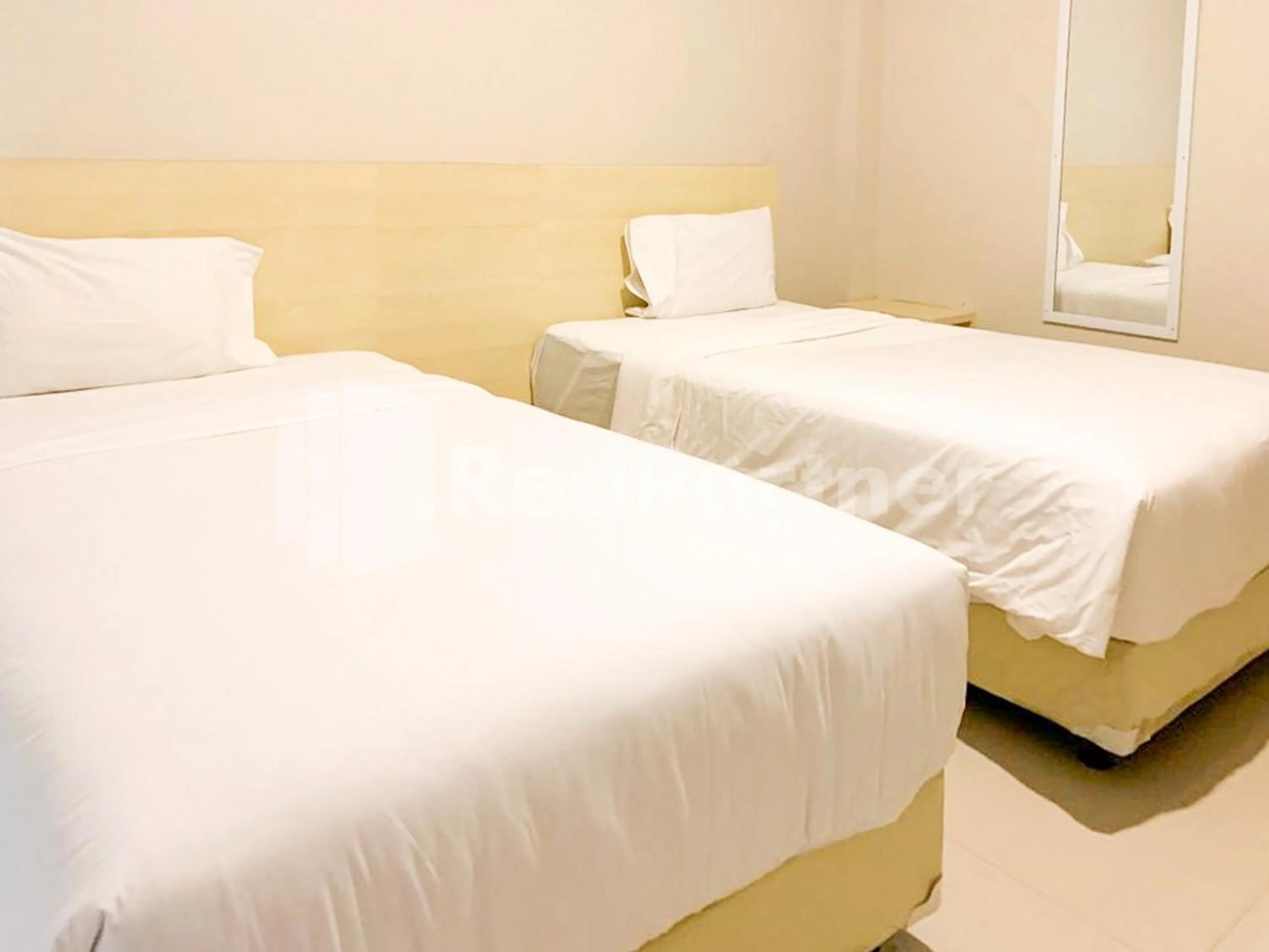 Bed in Hotel Andono near YIA Mitra RedDoorz