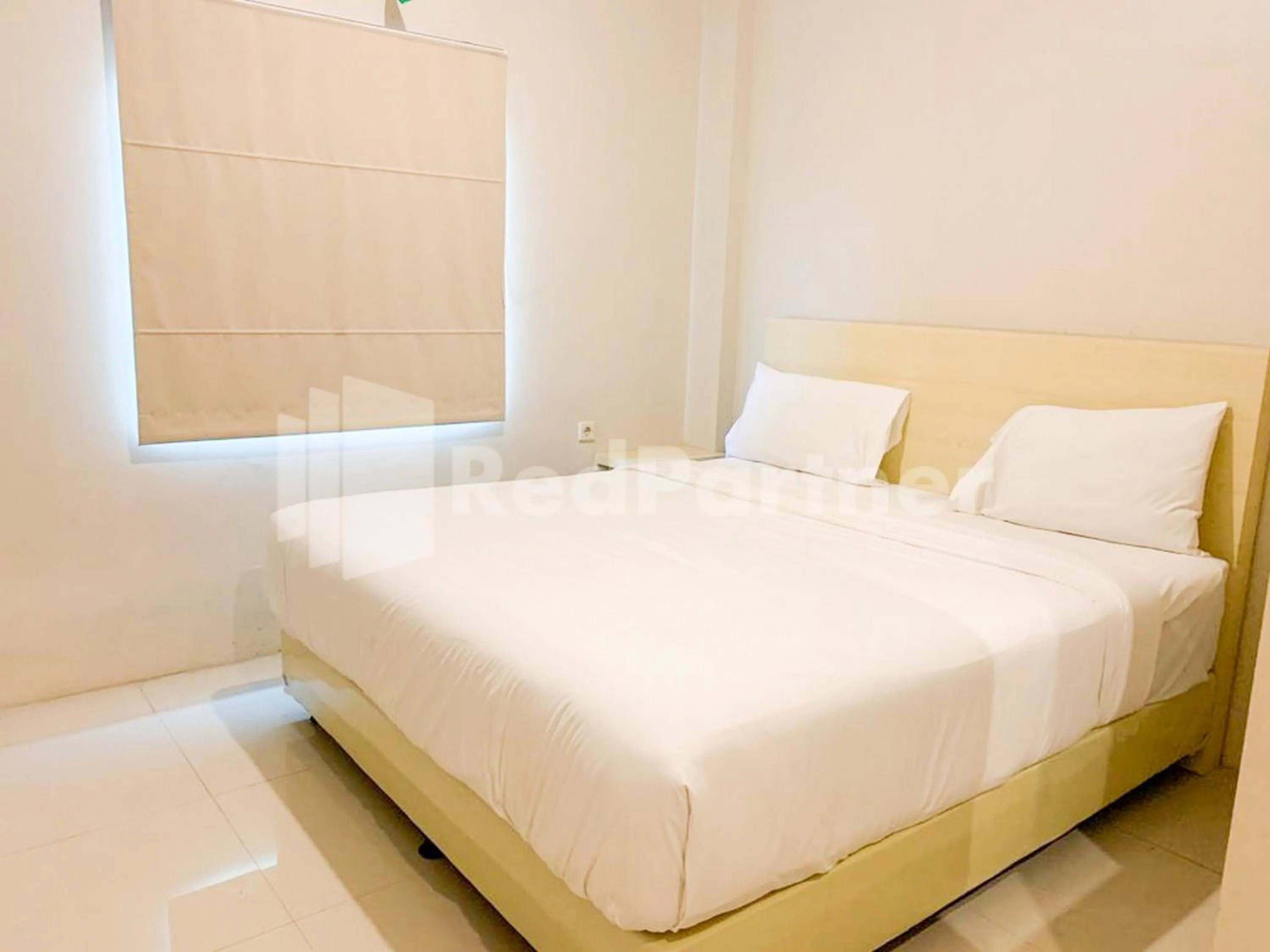 Bed in Hotel Andono near YIA Mitra RedDoorz