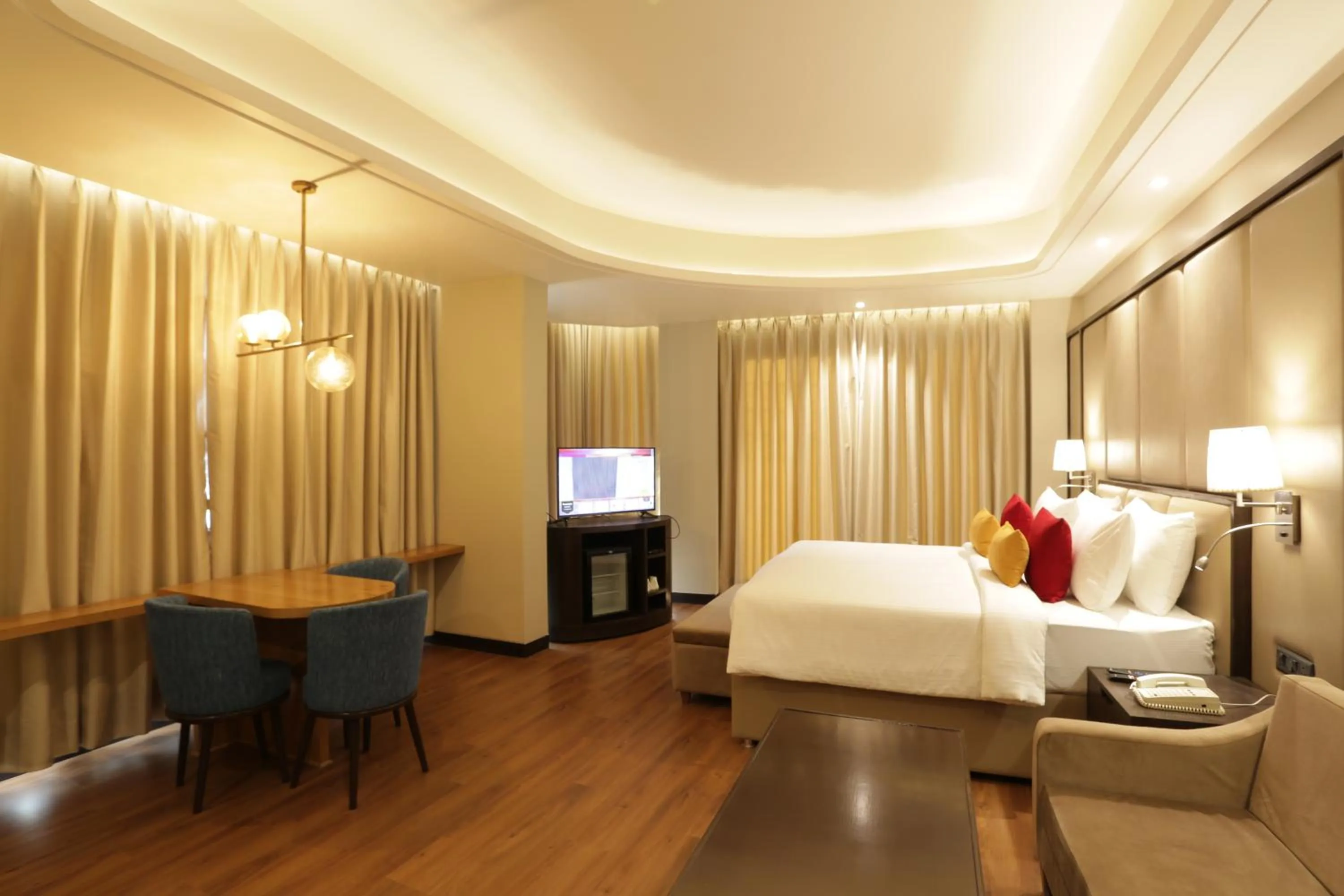 Photo of the whole room, Bed in The Vaishnodevi Sarovar Portico