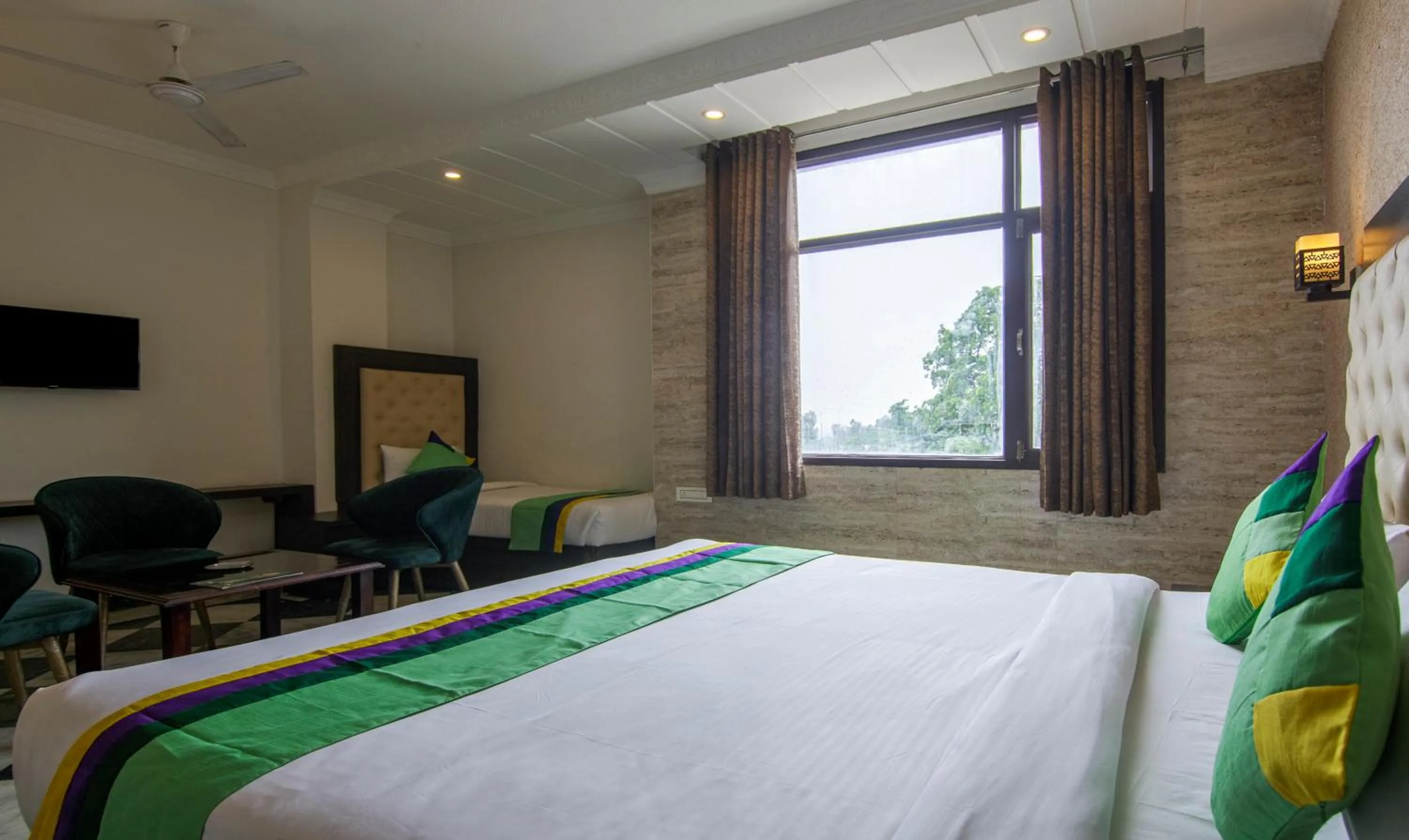 Bed in Treebo Trinetar International