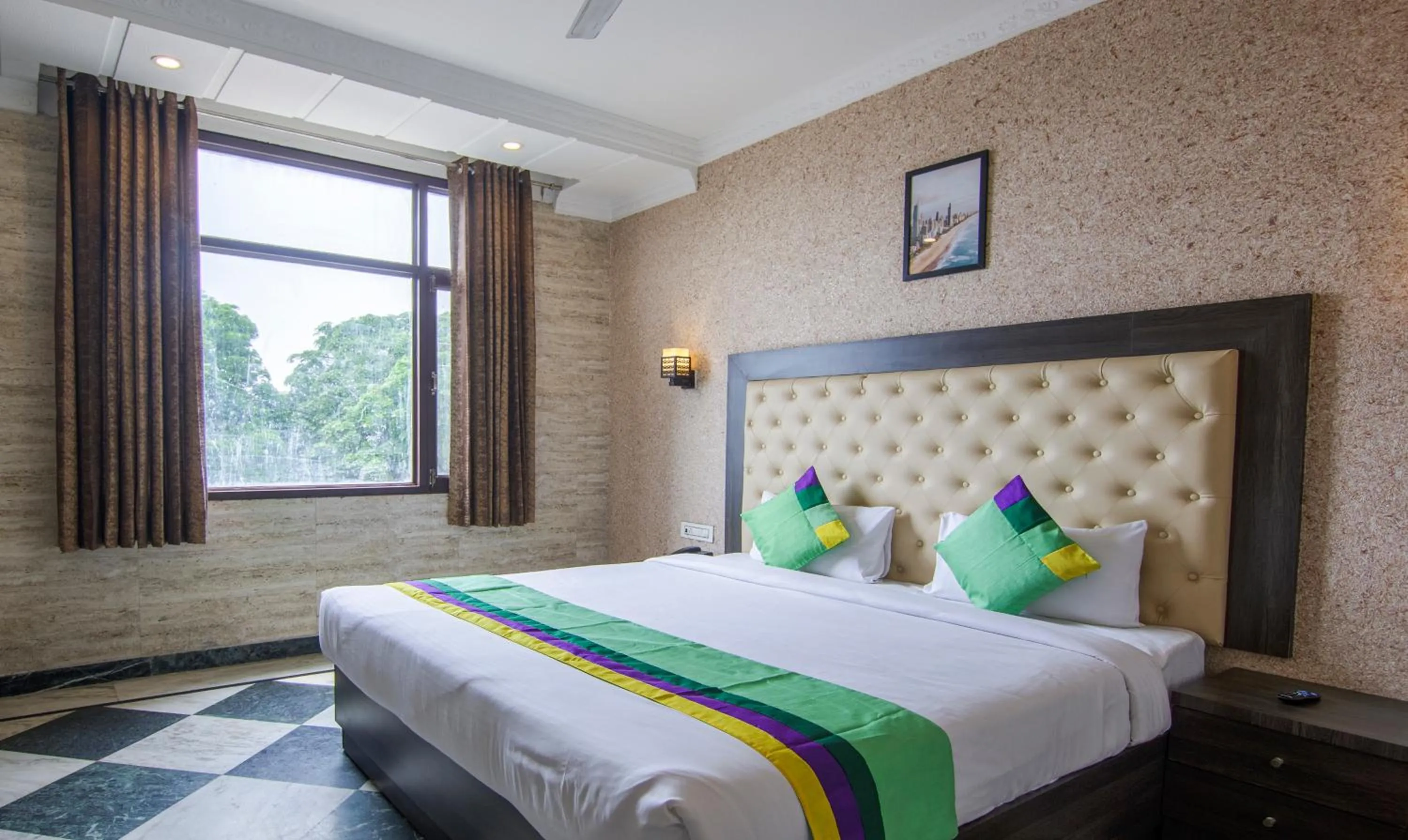 Bed in Treebo Trinetar International