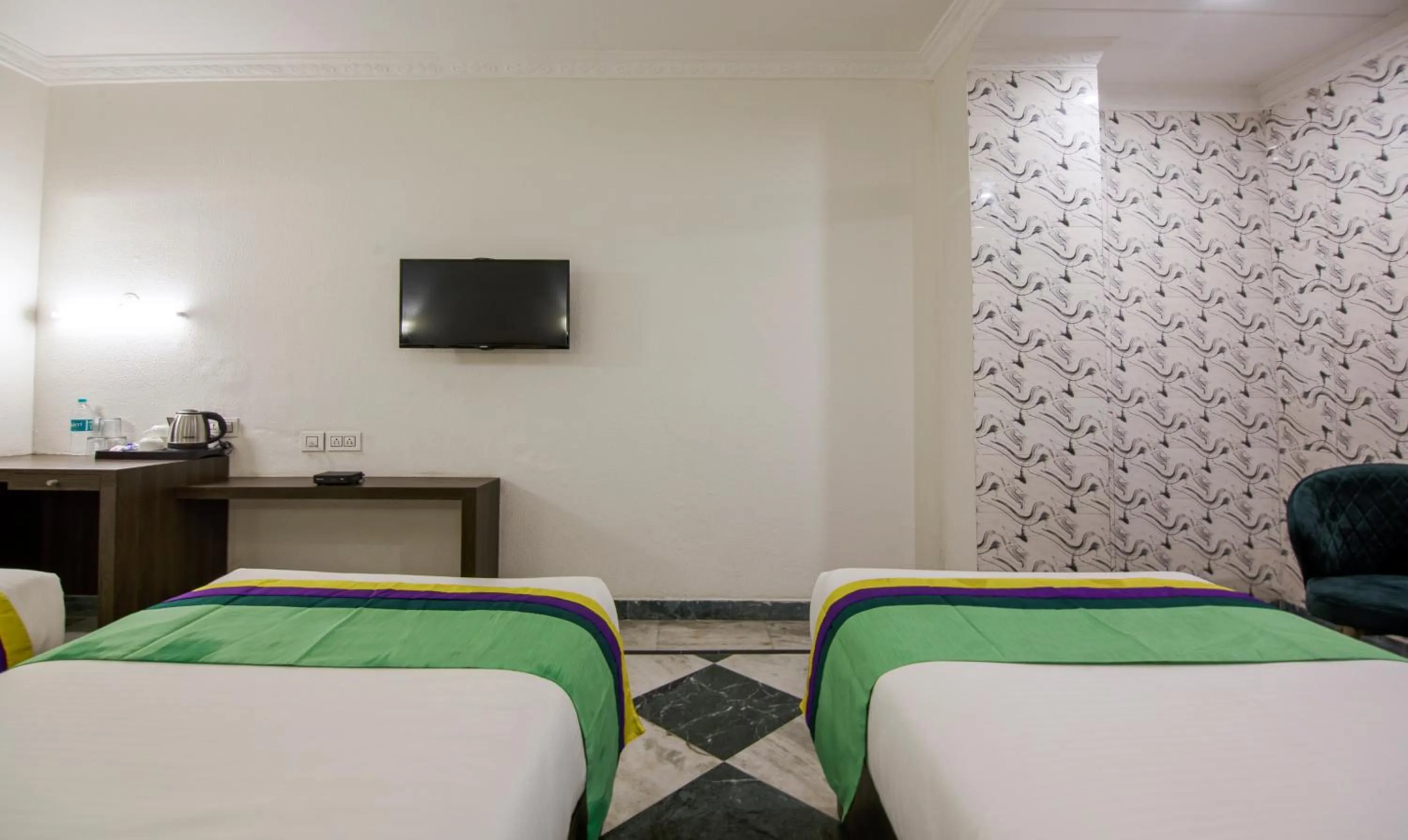 Bed in Treebo Trinetar International