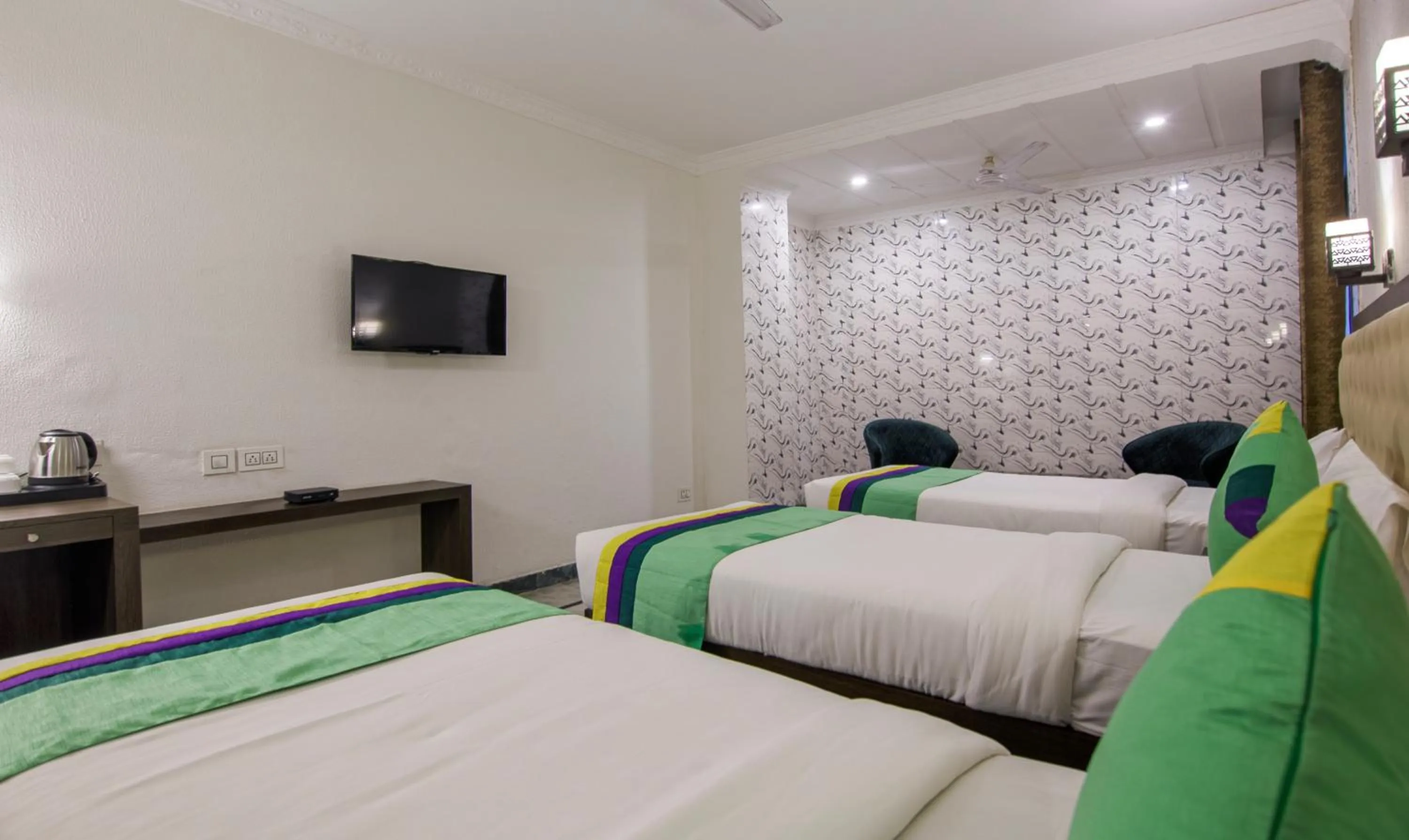 Bed in Treebo Trinetar International