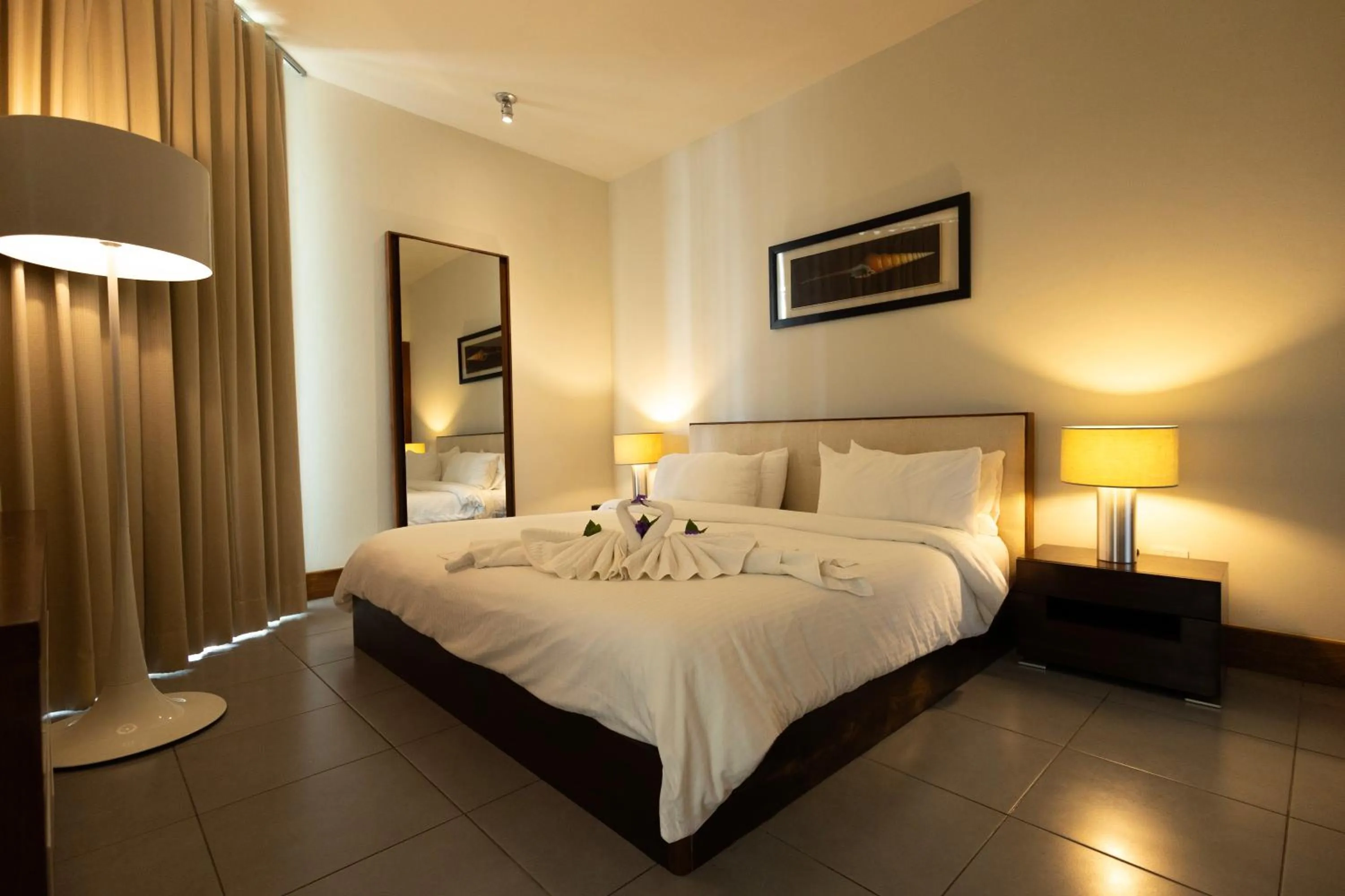 Bed in Ultravioleta Boutique Residences