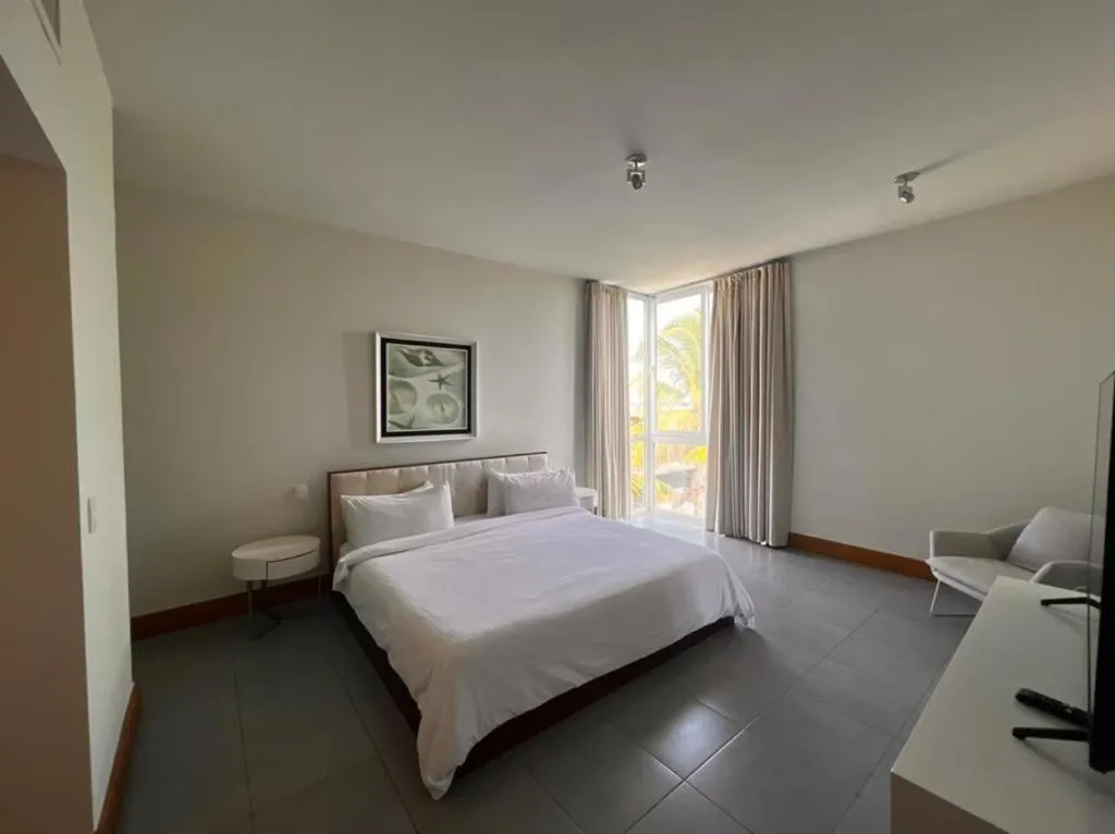 Bed in Ultravioleta Boutique Residences