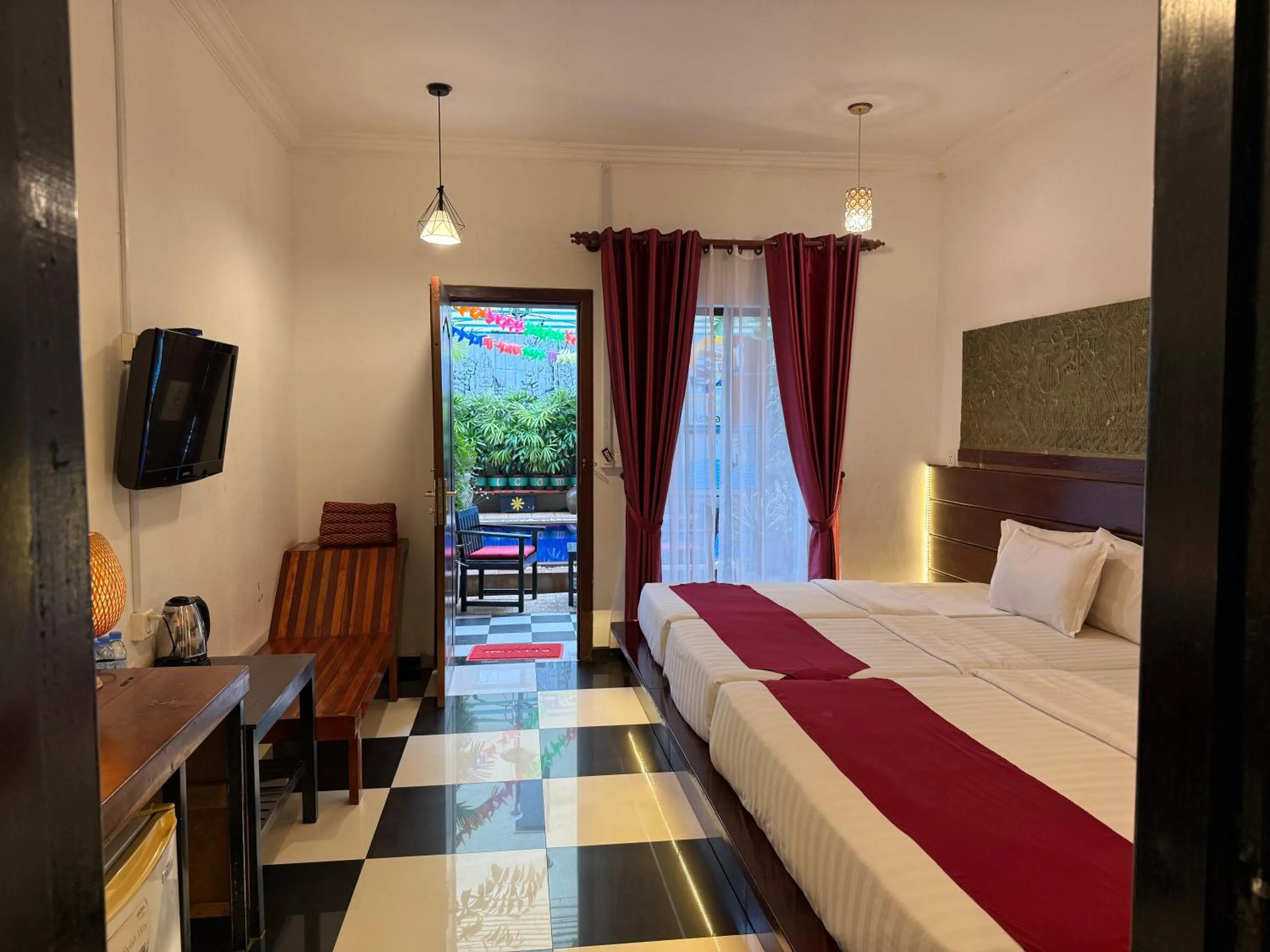 Bed in Asanak D'Angkor Boutique Hotel