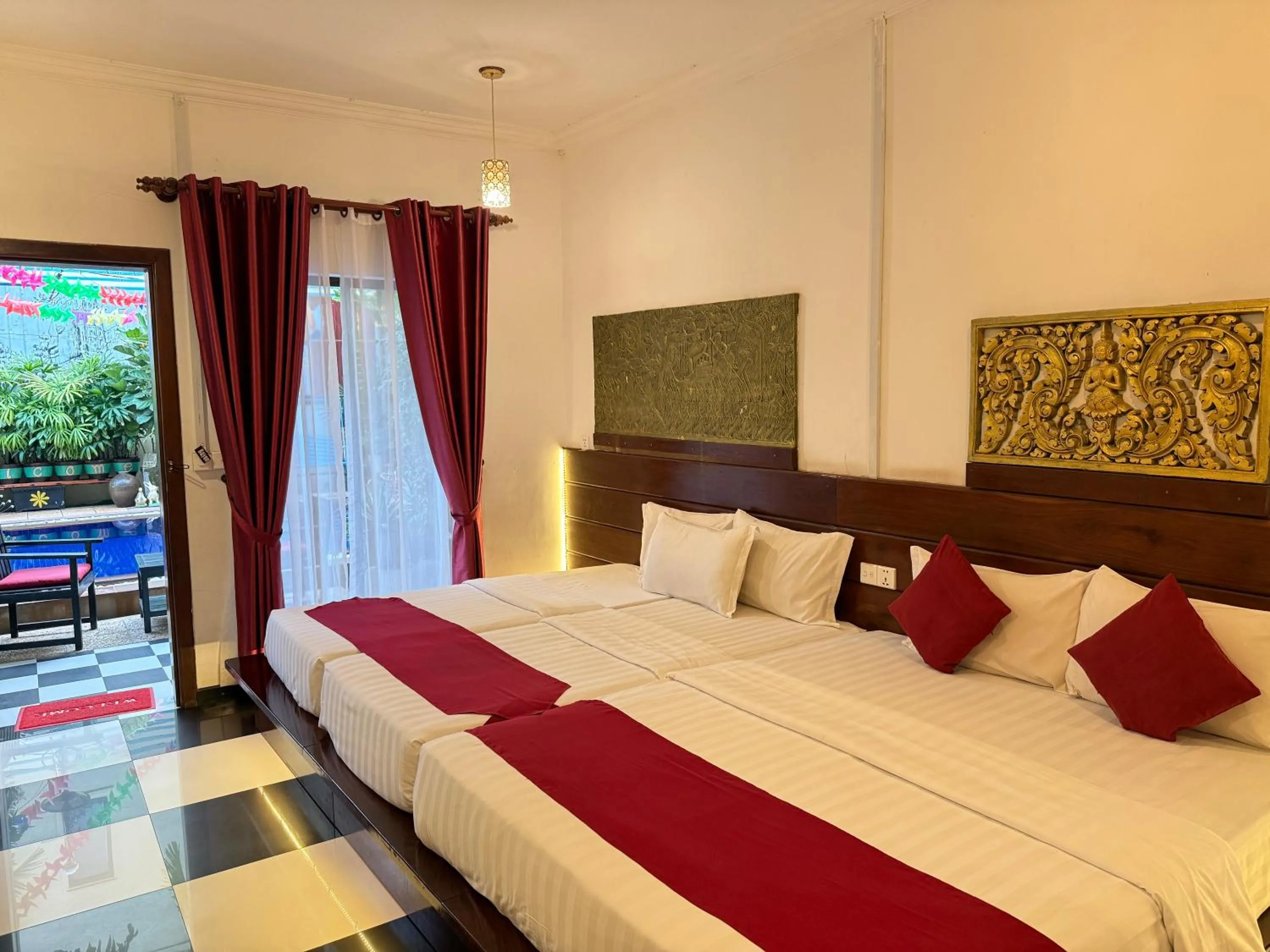 Bed in Asanak D'Angkor Boutique Hotel