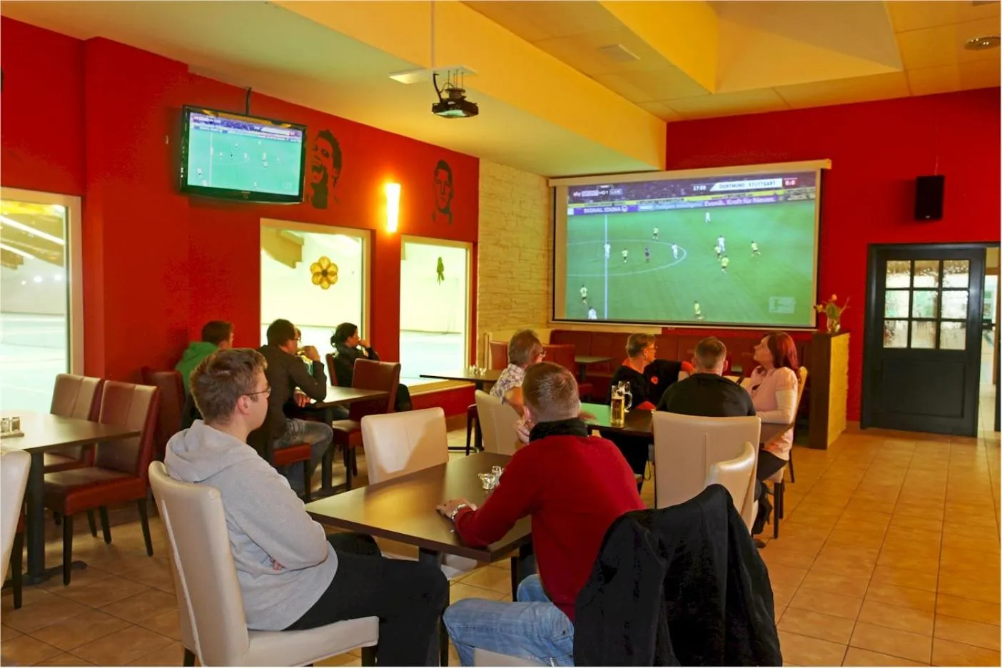 Communal lounge/ TV room in Sporthotel Neuruppin - Apartmenthaus mit Ferienwohnungen