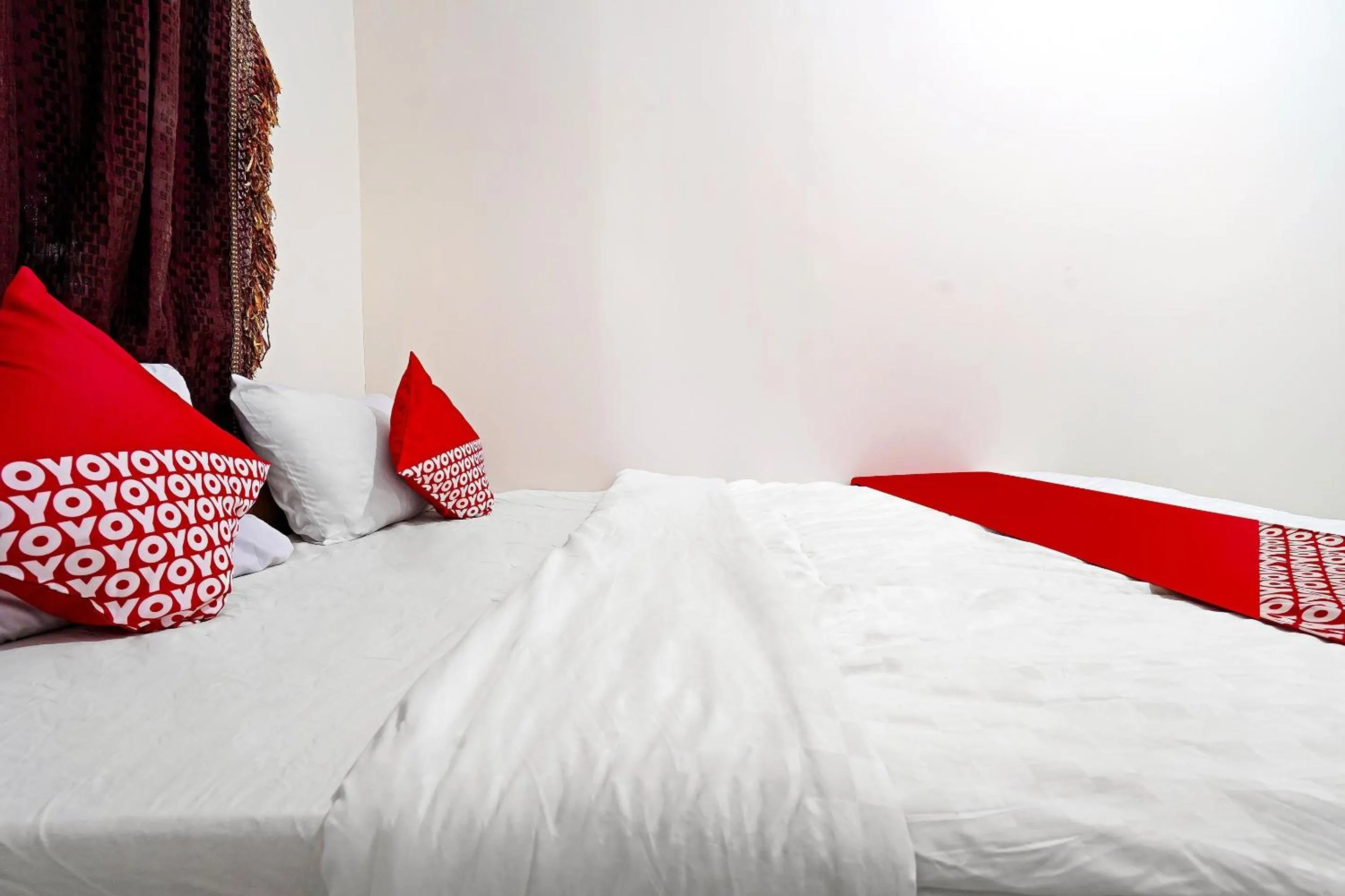 Bedroom in Hotel O Jawara Guest House Syariah