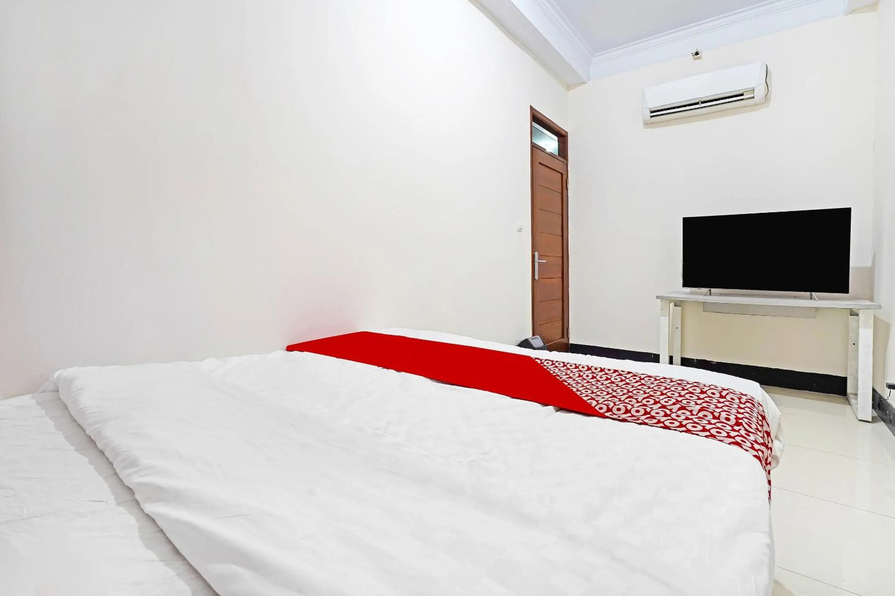 Bedroom in Hotel O Jawara Guest House Syariah