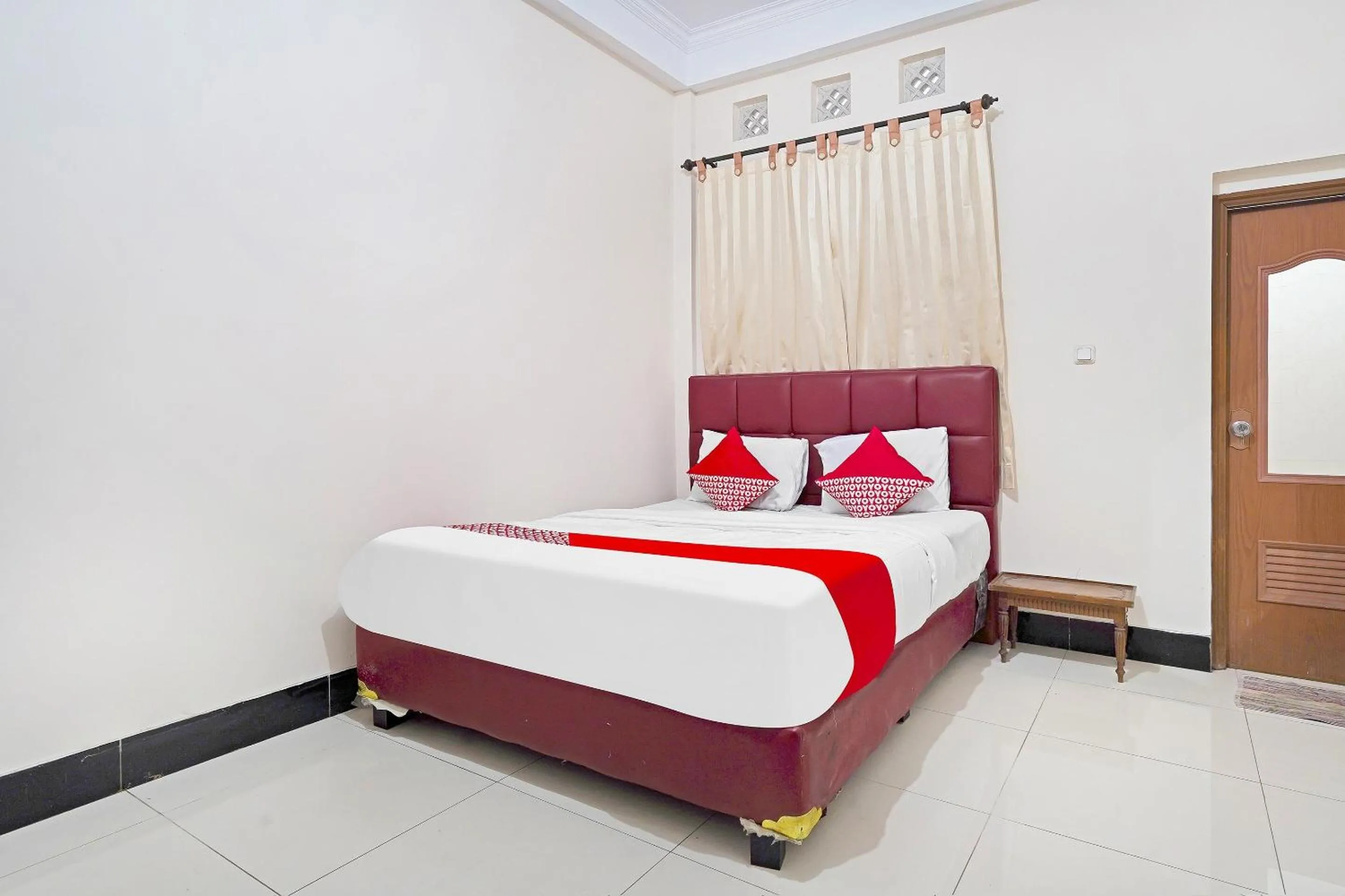 Bedroom in Hotel O Jawara Guest House Syariah