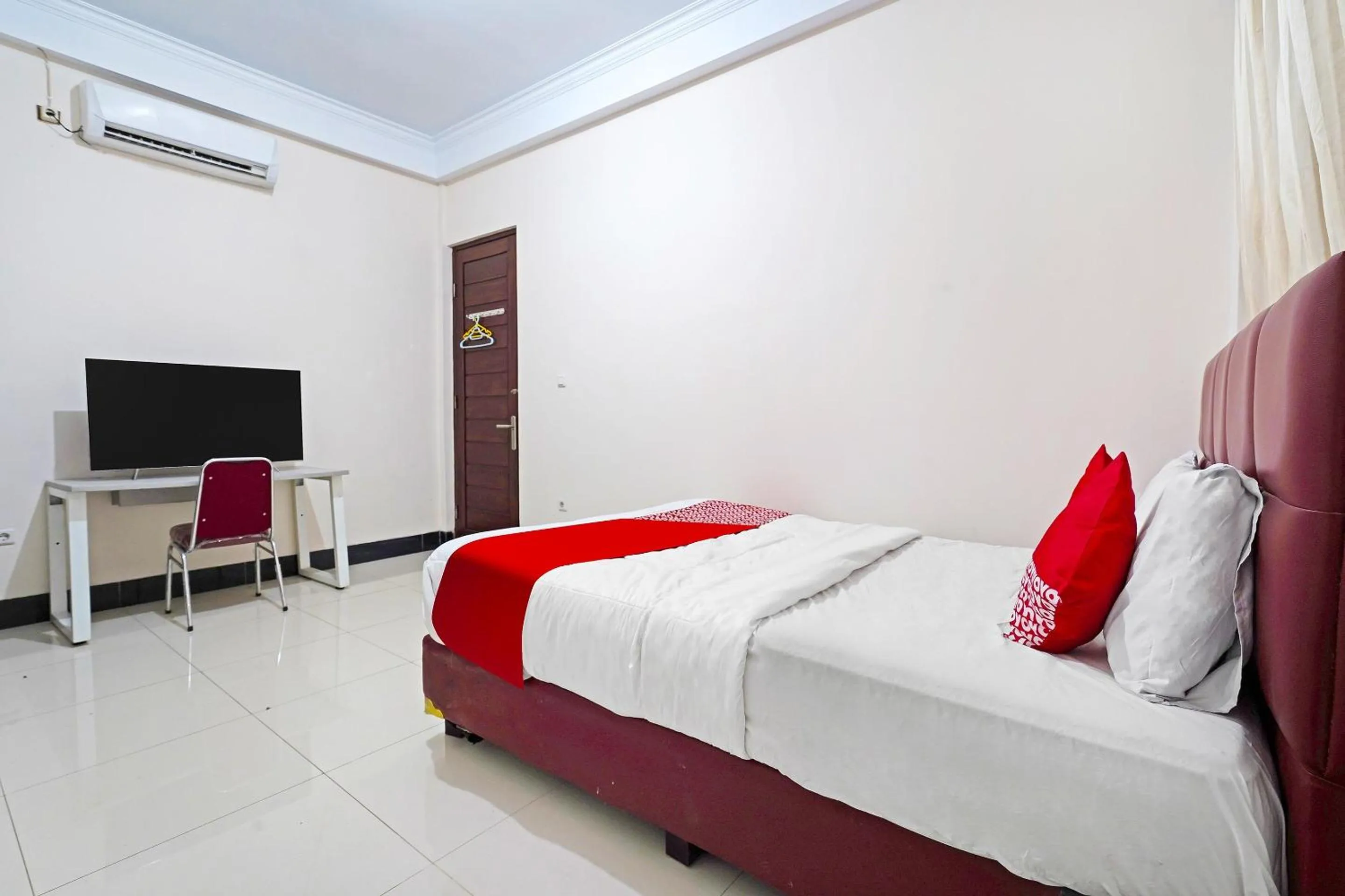 Bedroom in Hotel O Jawara Guest House Syariah