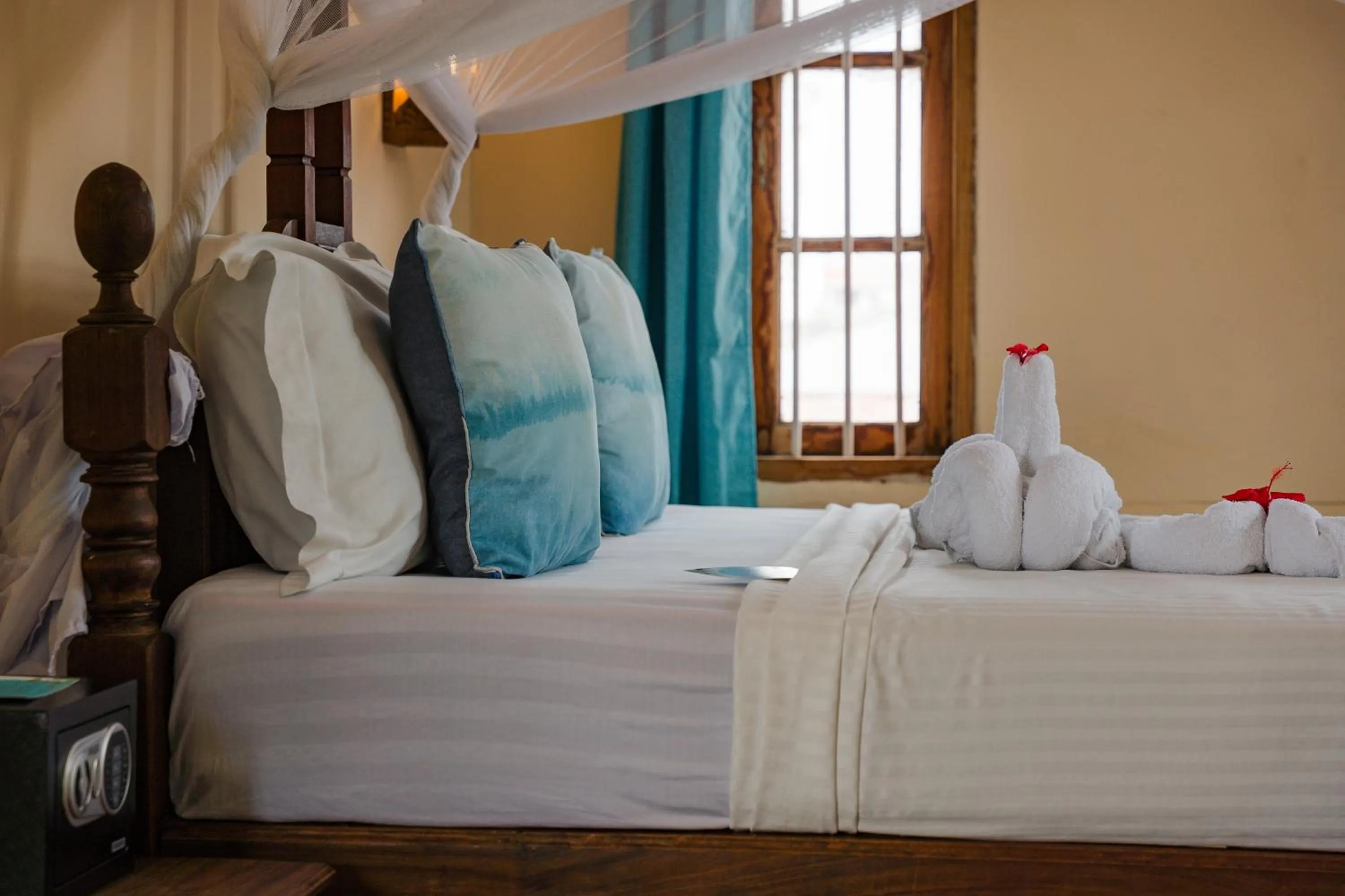 Bed in Emerald Palm Boutique Hotel