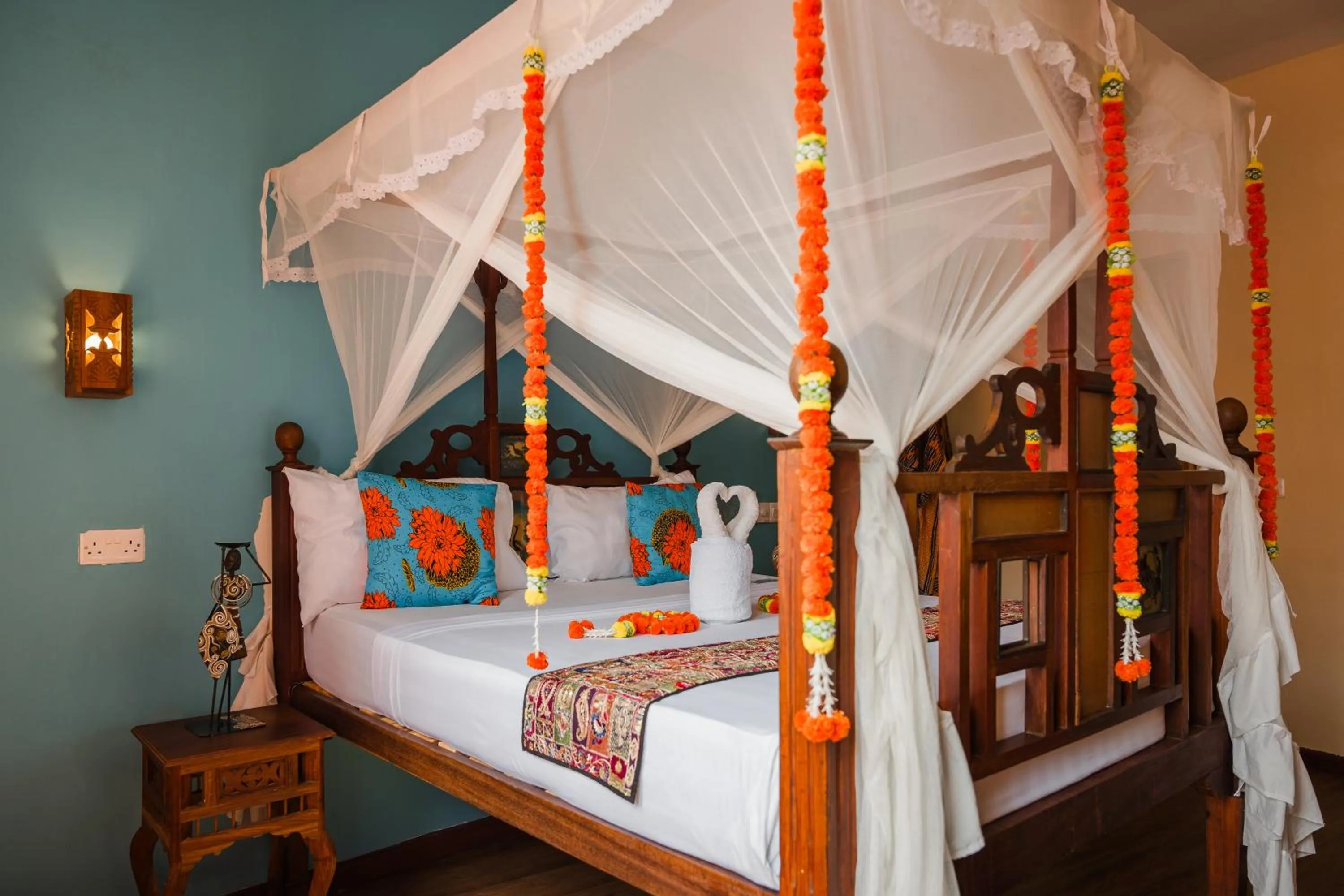 Bed in Emerald Palm Boutique Hotel