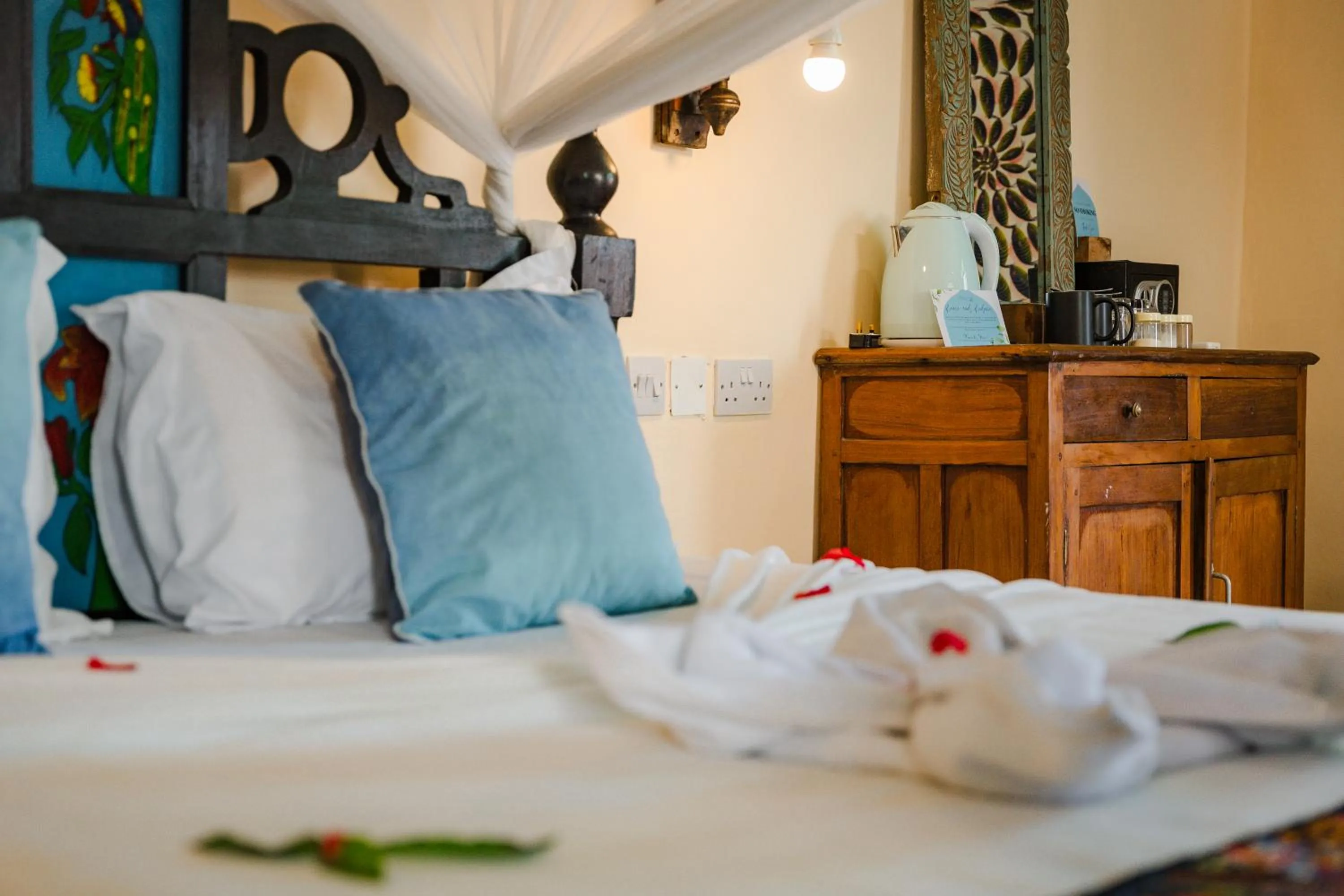 Bed in Emerald Palm Boutique Hotel