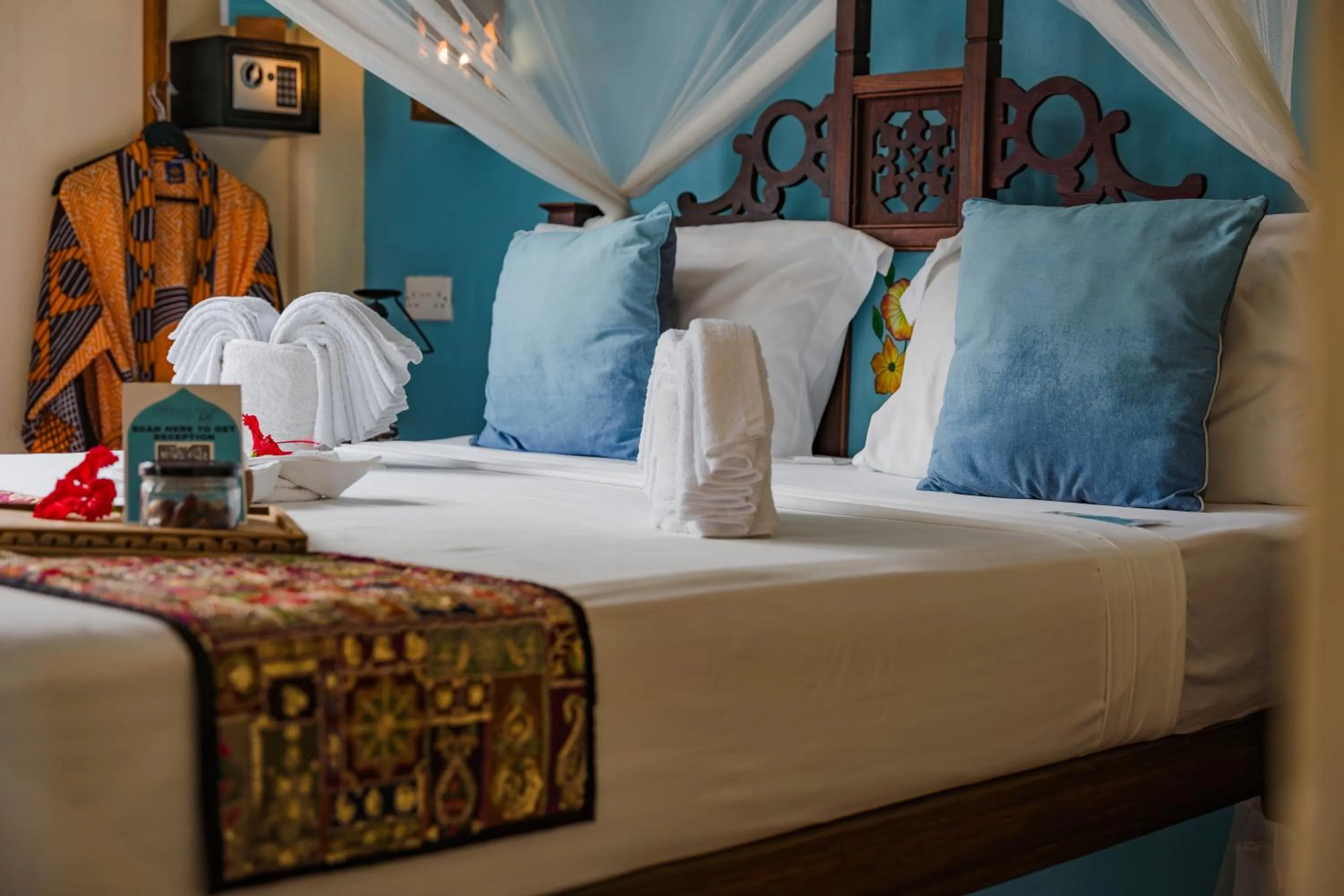 Bed in Emerald Palm Boutique Hotel