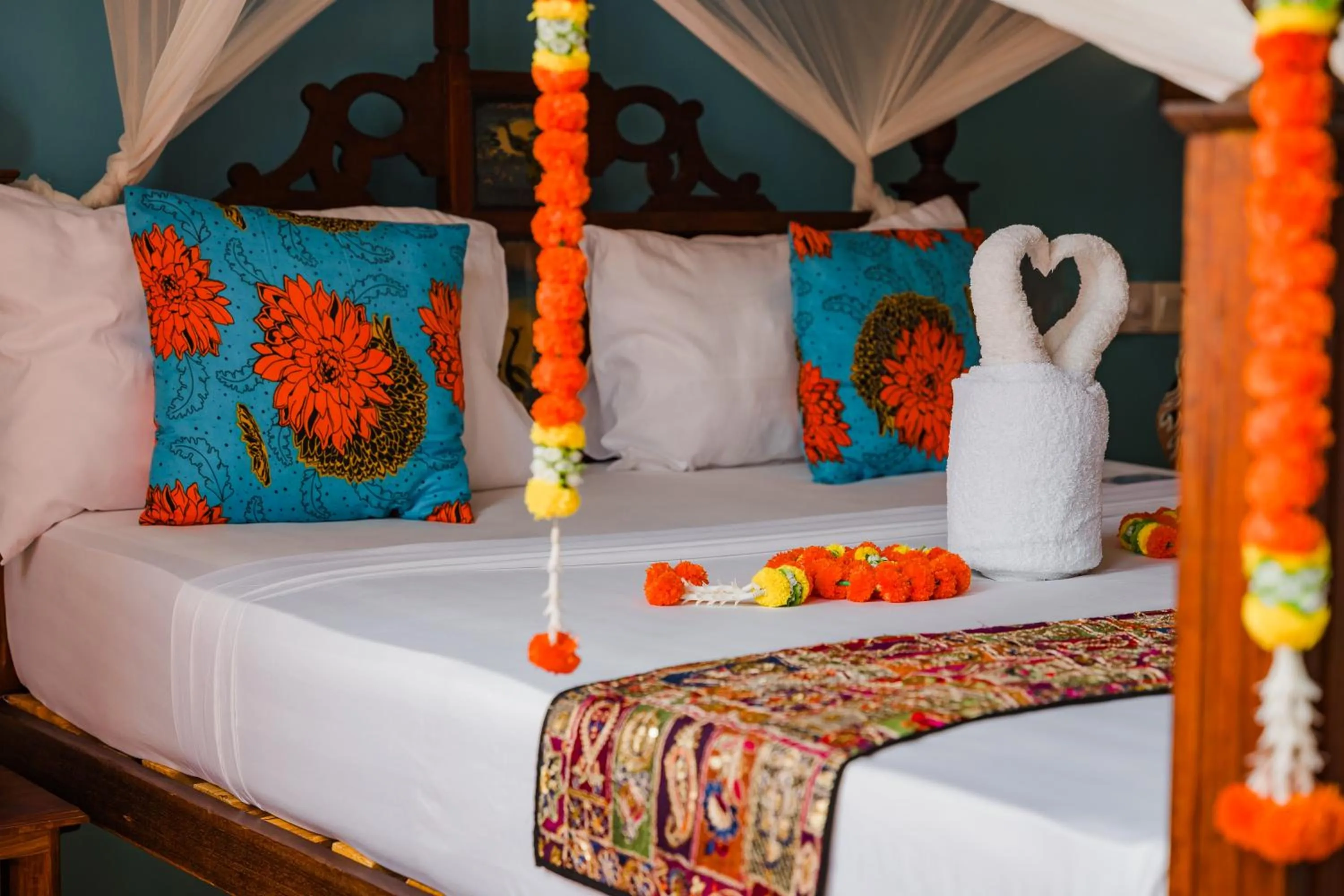 Bed in Emerald Palm Boutique Hotel