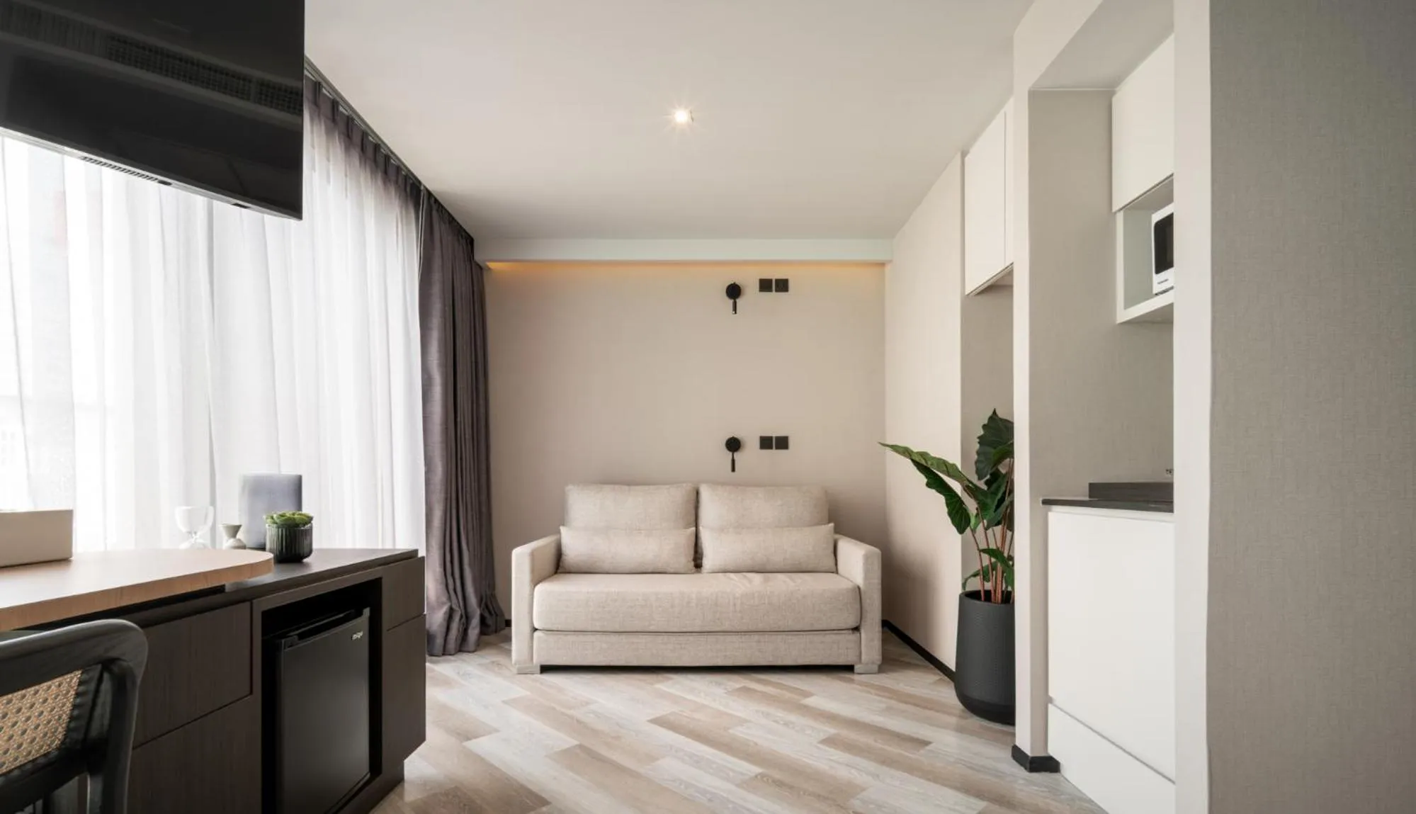 Living room in Seekers Finders Rama IV Hotel SureStay Collection by BW