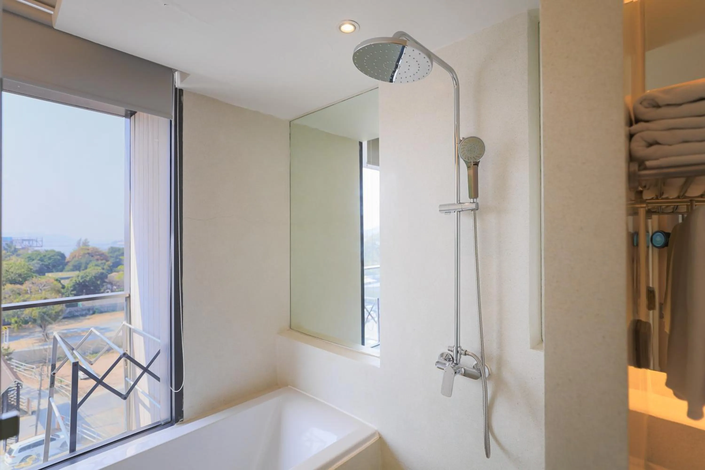 Shower in Balcony Seaside Sriracha Hotel & Serviced Apartments